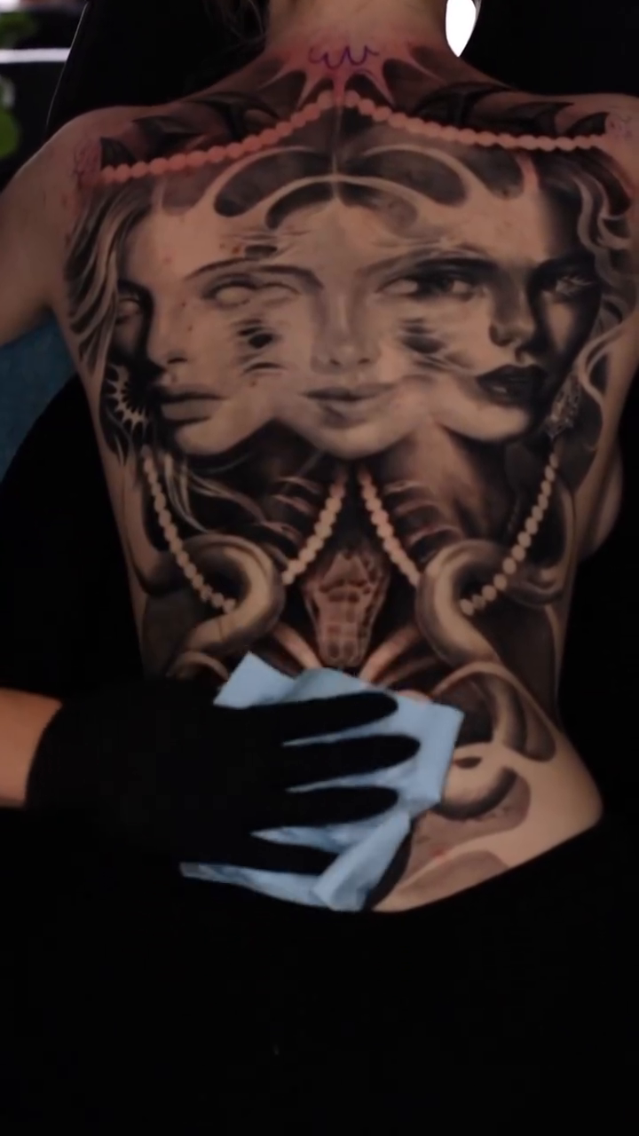 Multiple faces and tentacles realism tattoo by Naomi Burke, New Westminster, British Columbia