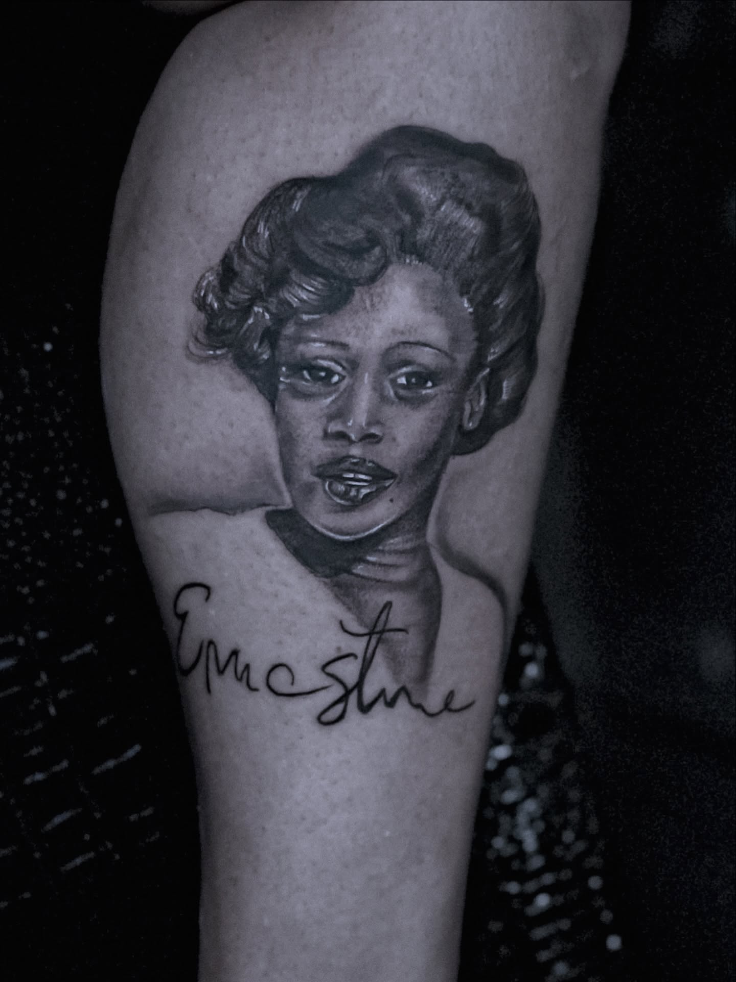 Portrait realism tattoo on the forearm by Ken West