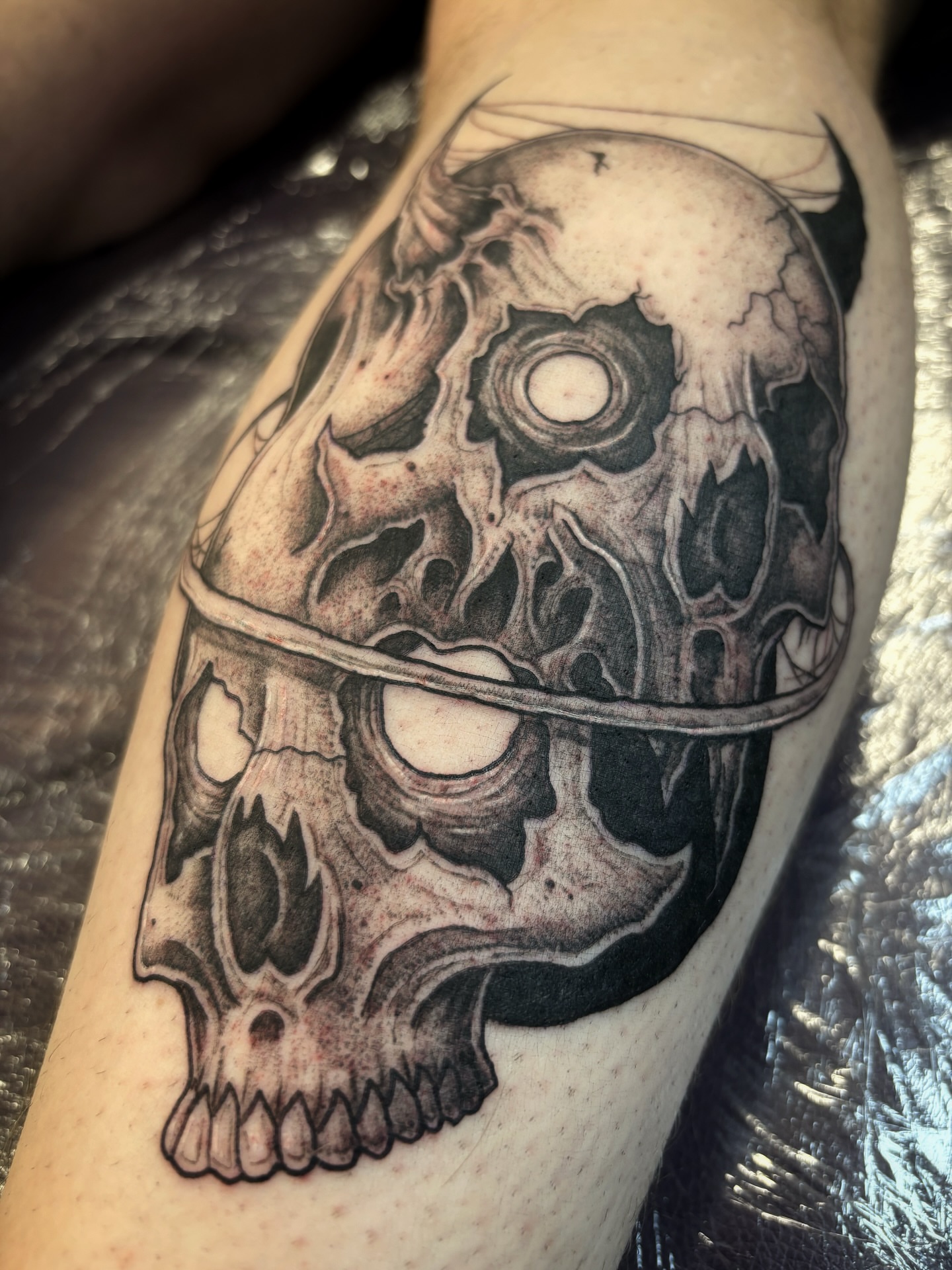 Tattoo by @scorchedbones_ — black_and_grey, realism
