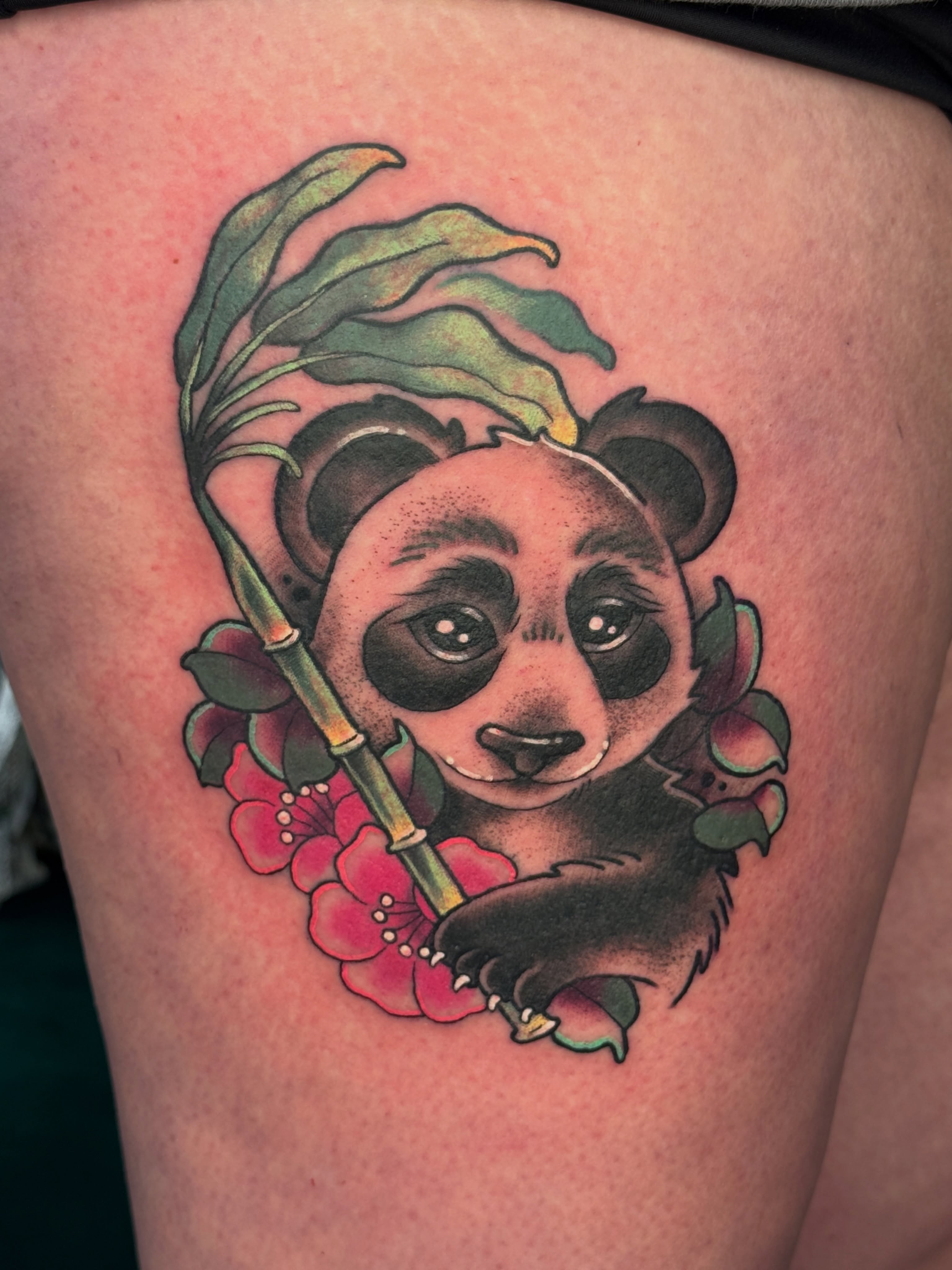 Panda bear American traditional tattoo on the thigh by Tattoos by Angel Lee