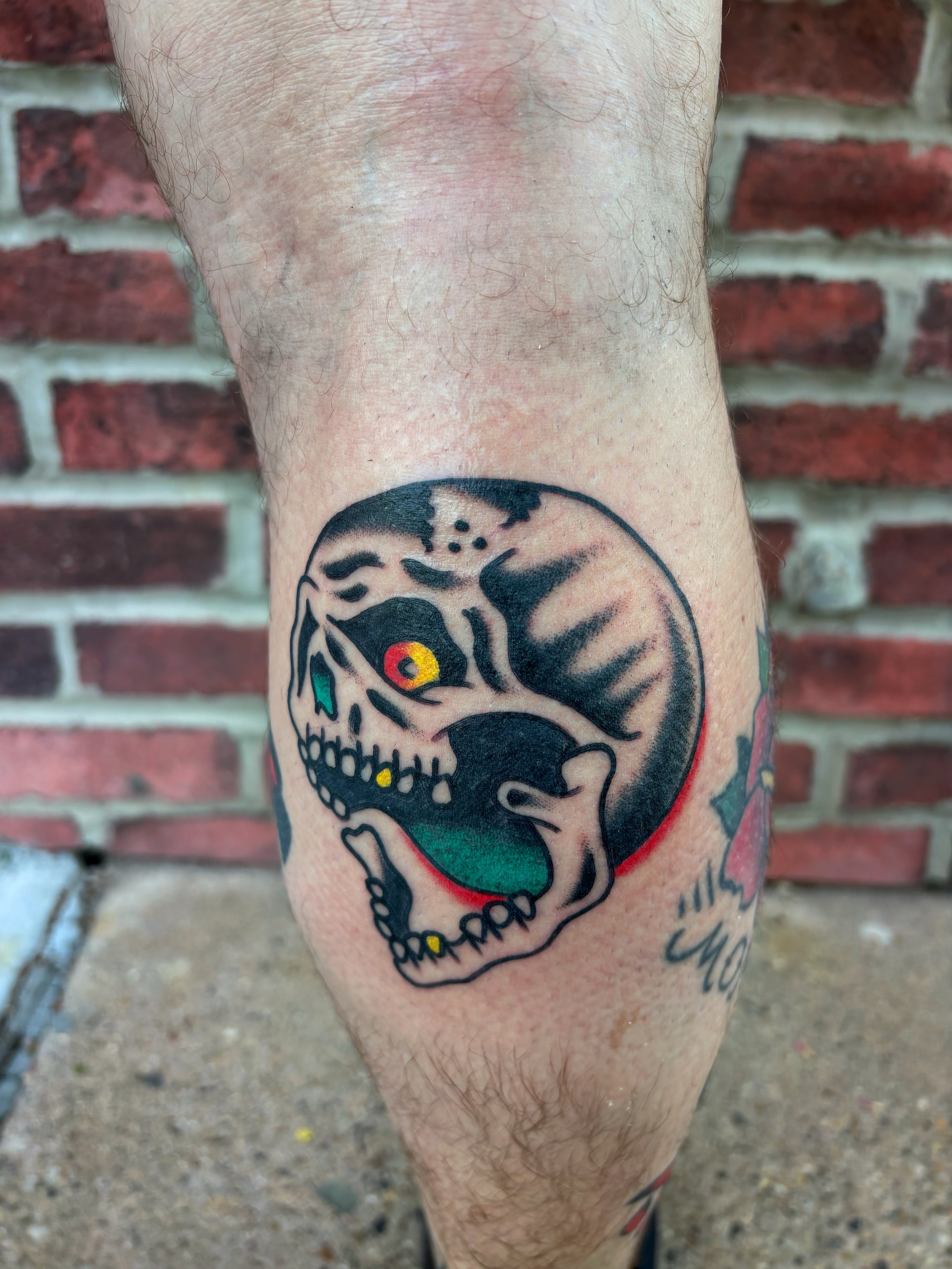 Skull American traditional tattoo on the forearm by Cooper Reichwein