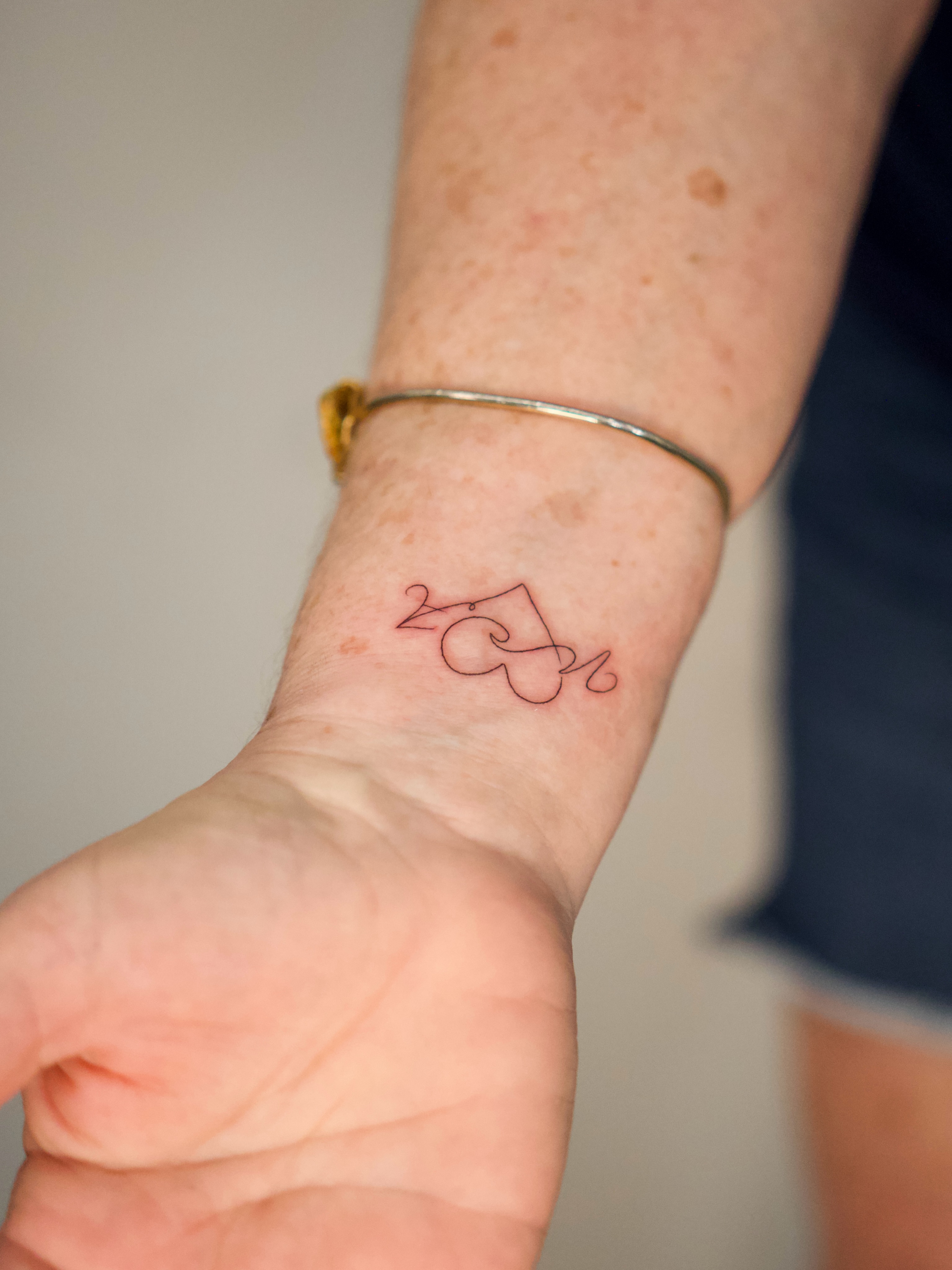 Abstract line art fine line tattoo on the forearm by Tattoo fine line NY
