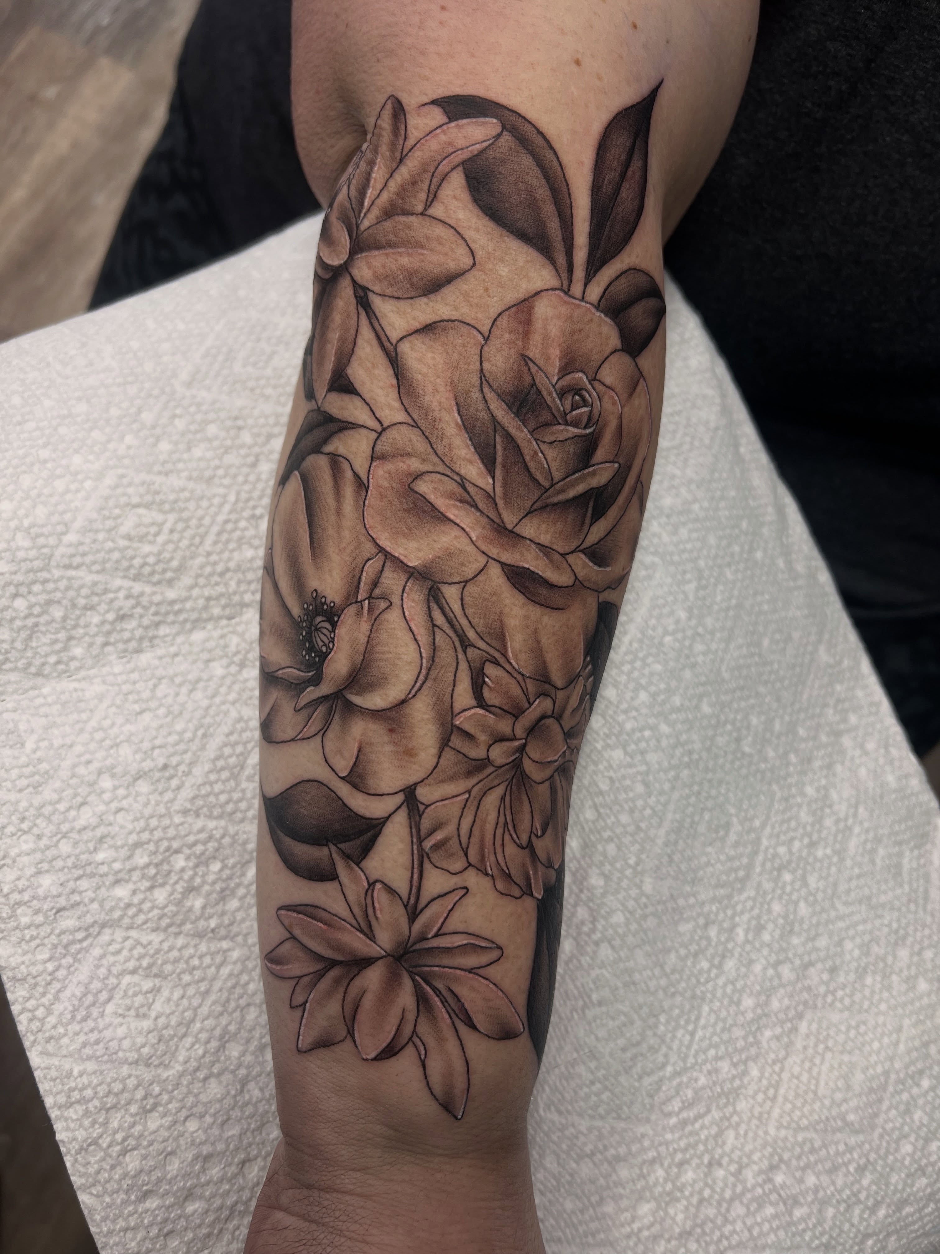 Flowers realism tattoo on the forearm by Olivia Suzanne Fada