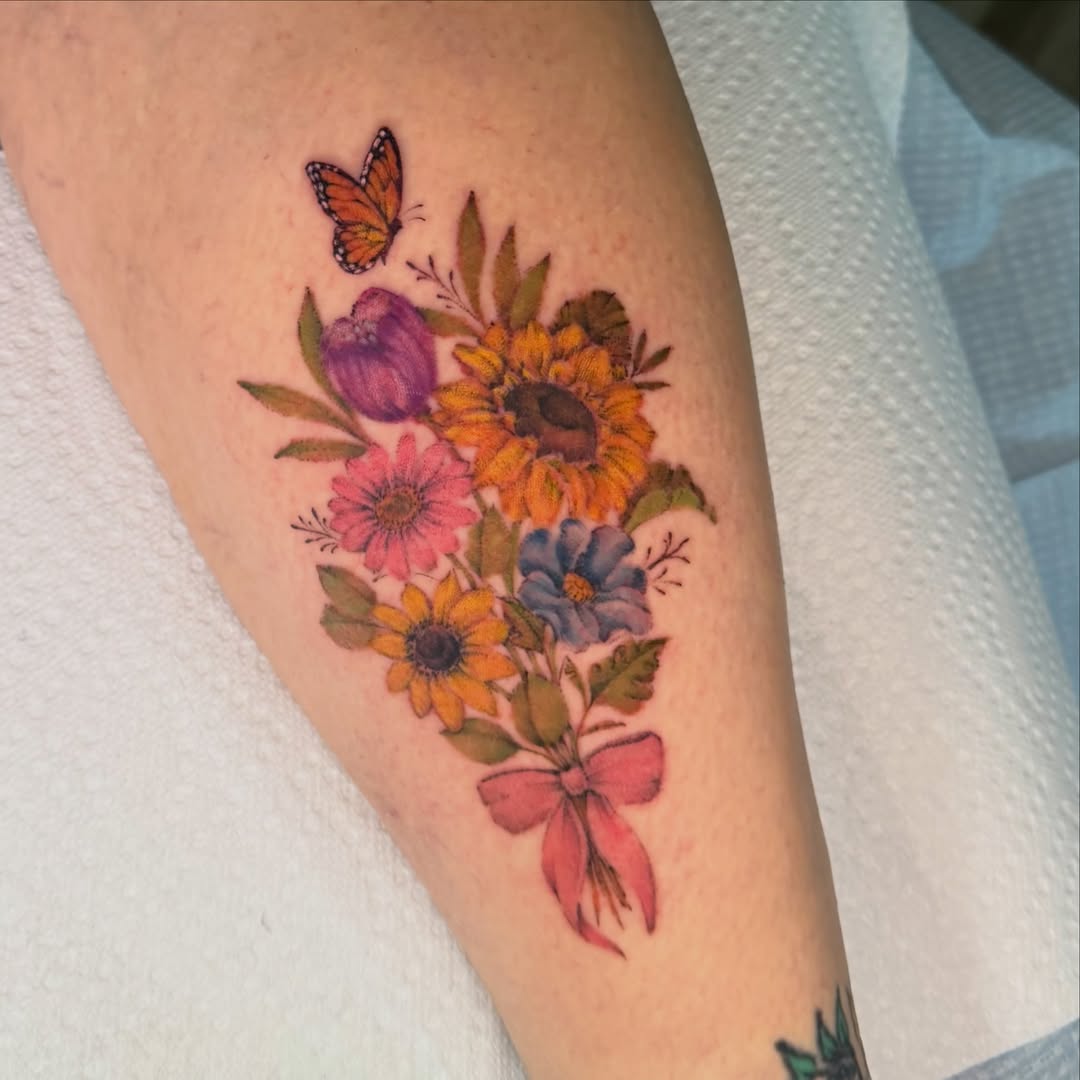 Flower bouquet watercolor tattoo on the forearm by Chiah