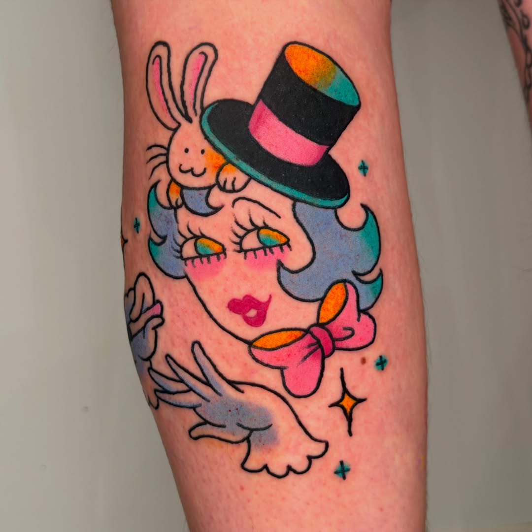 Clown with rabbit new school tattoo on the forearm by Gus Roach Graves
