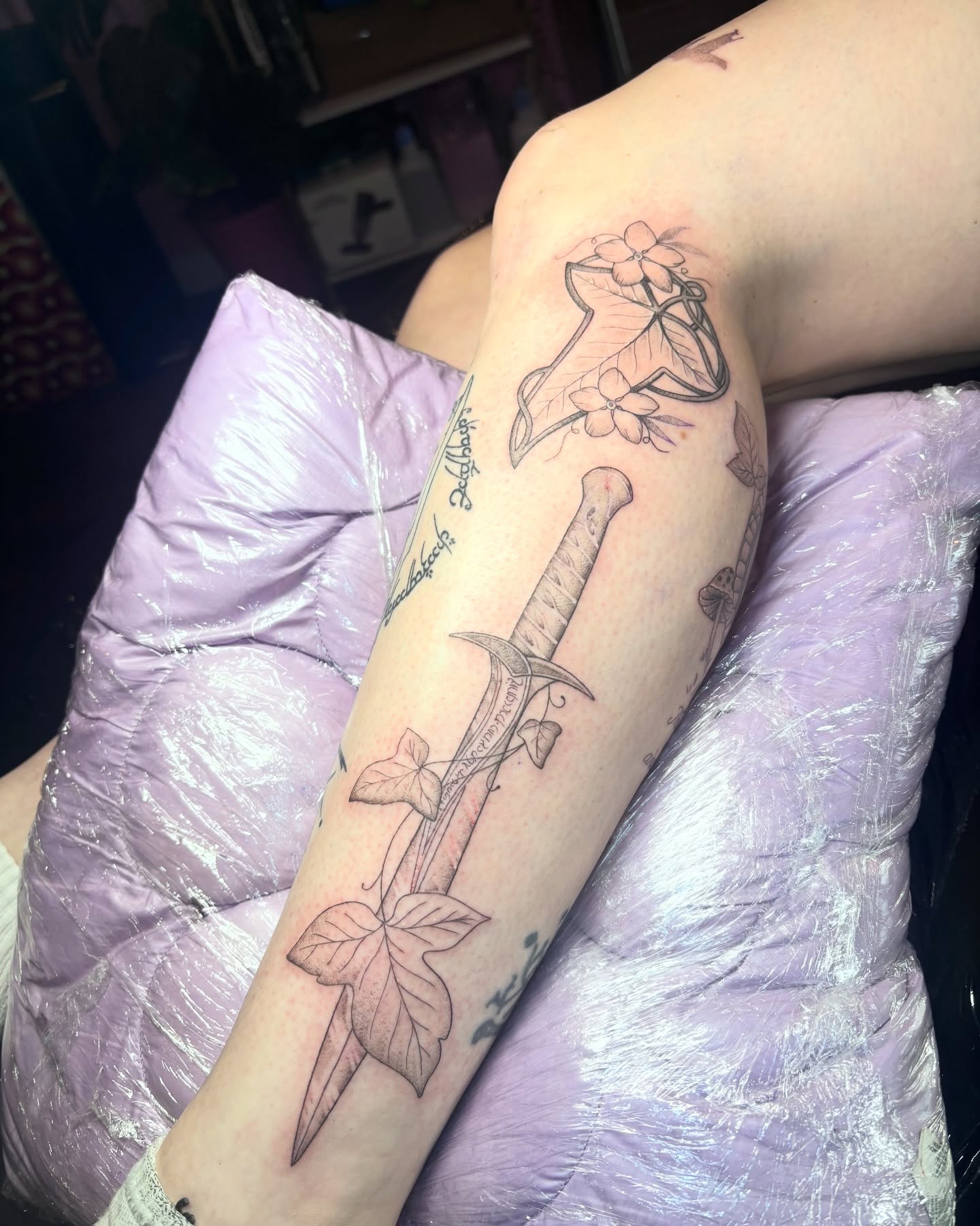 Sword and ivy black and grey tattoo on the forearm by Charlotte Brown, Leeds, England