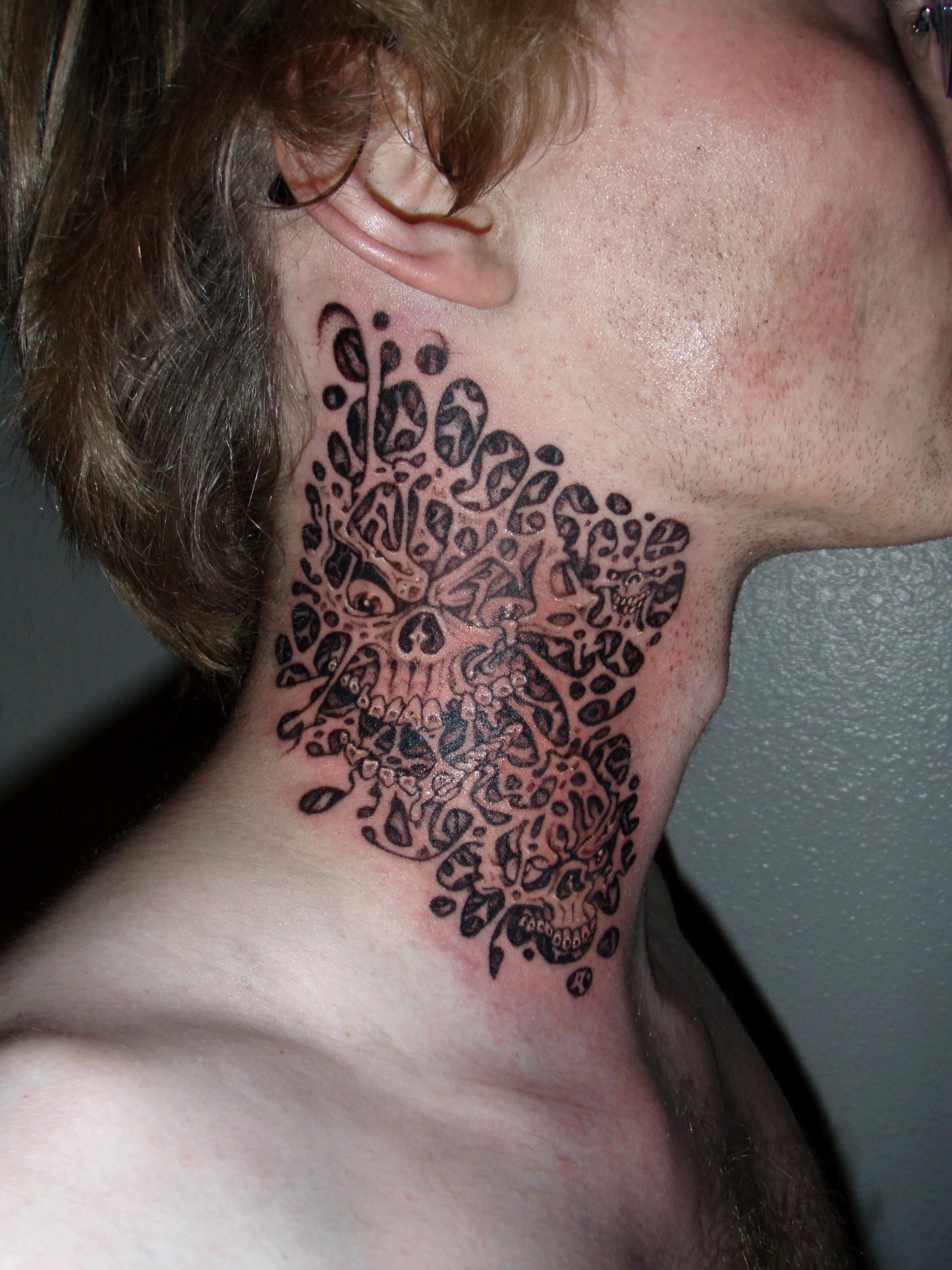 Skull black and grey tattoo on the neck by Brendan Smith