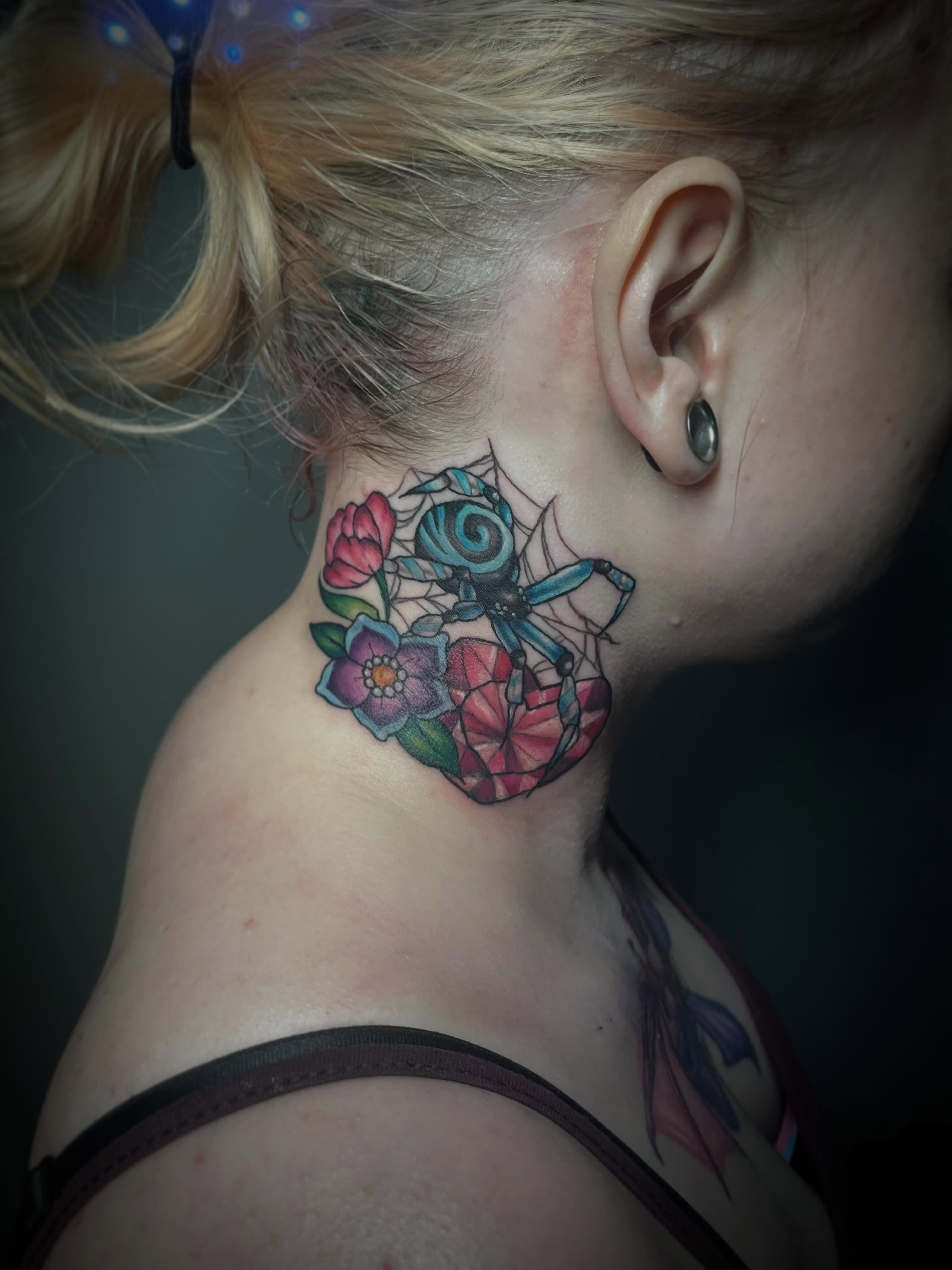 Spider and flowers geometric tattoo on the neck by Hannah Copeskey