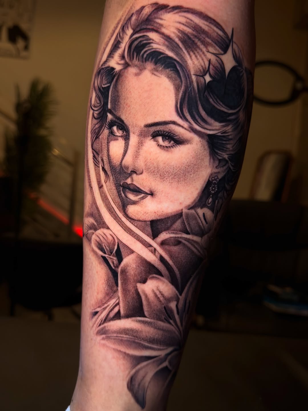 Woman portrait with flowers realism tattoo on the forearm by Eduardo Chaparro