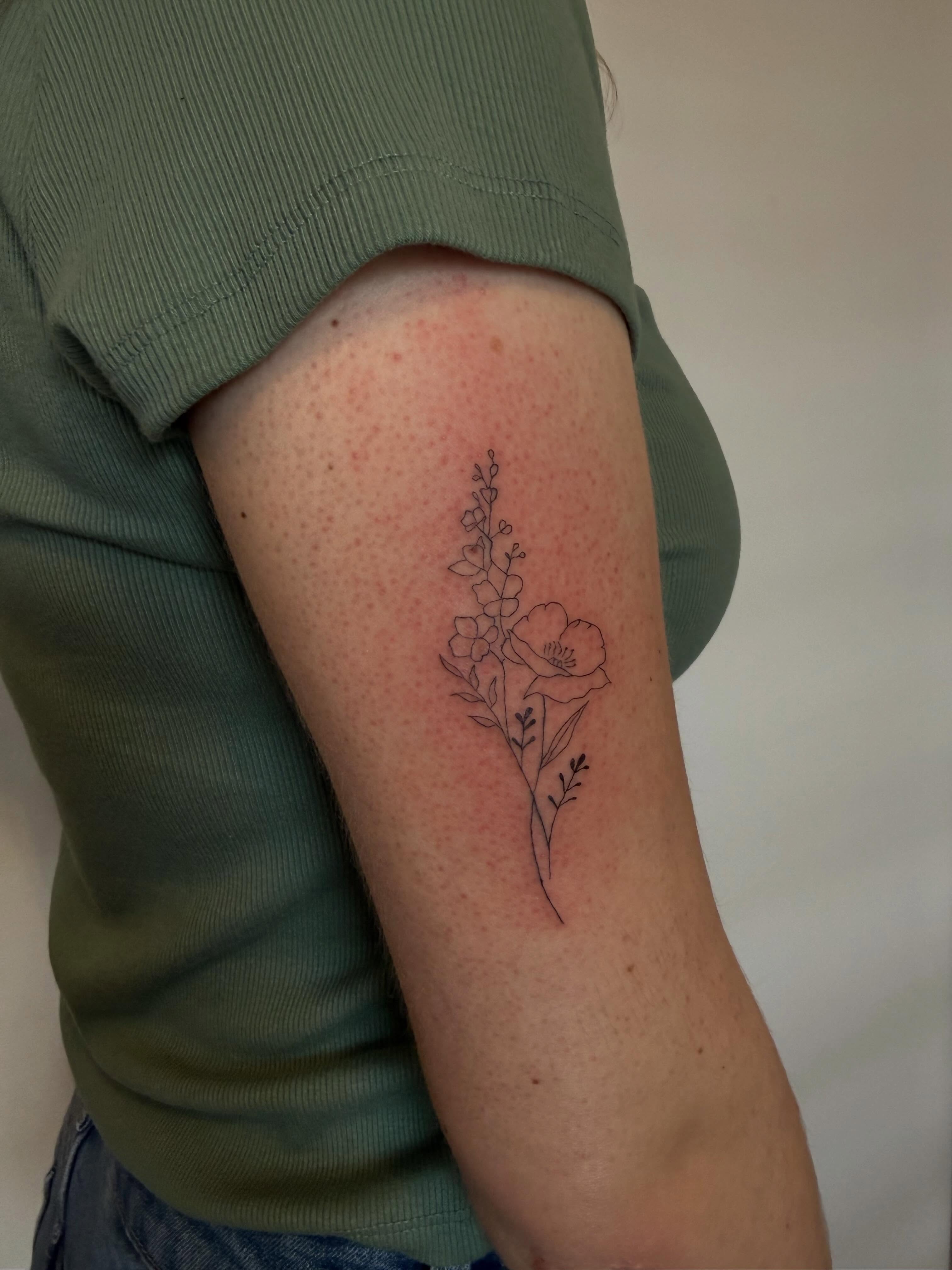 Flower and leaves fine line tattoo on the forearm by Lexie Decker, Canton, Ohio