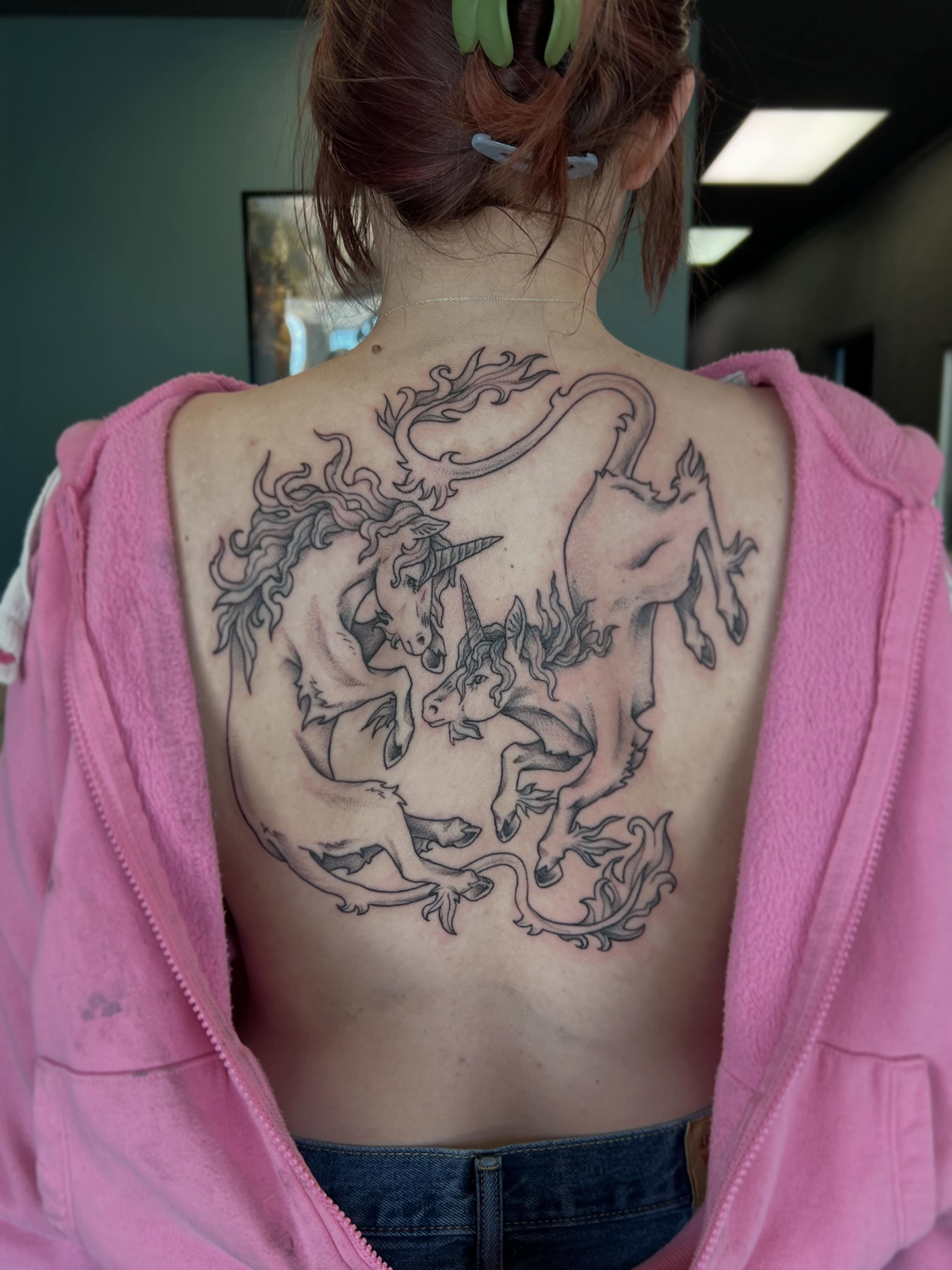 Unicorns black and grey tattoo on the back by Callie πͺ