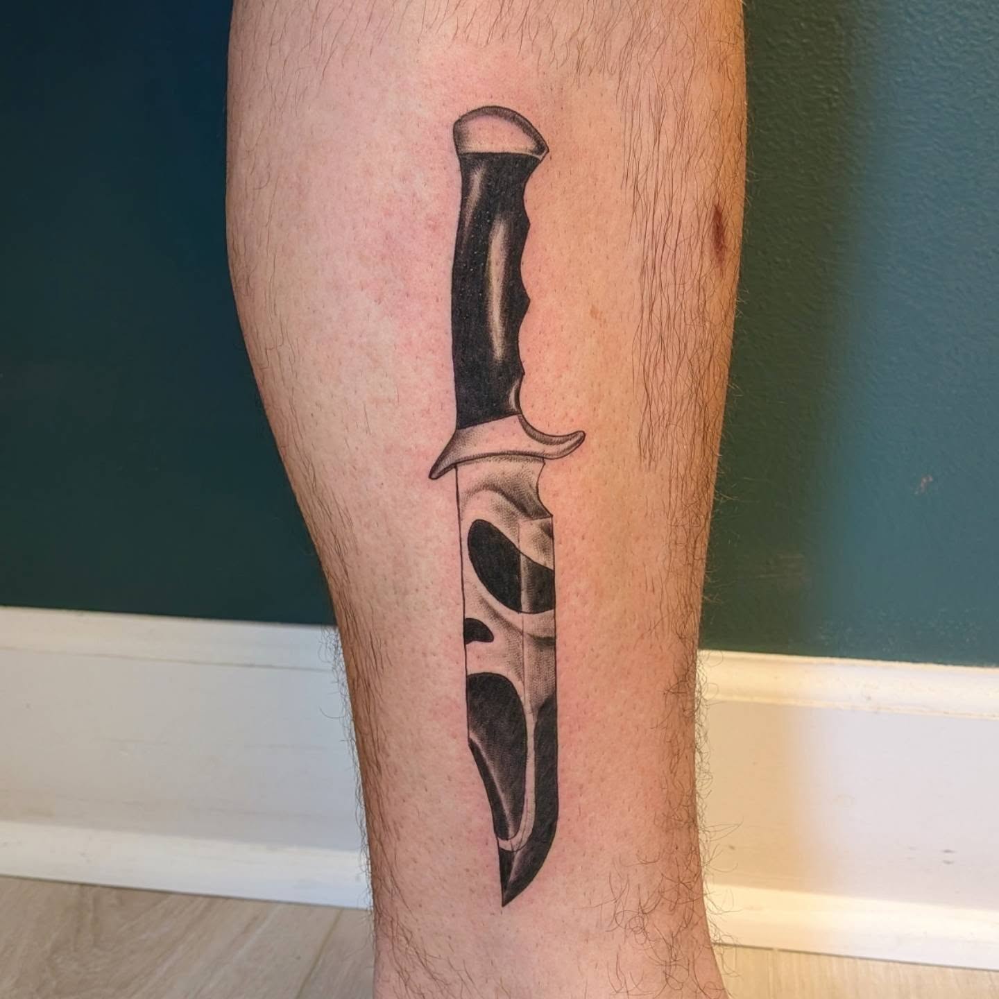 Knife black and grey tattoo on the calf by L U C y, Knoxville, Tennessee