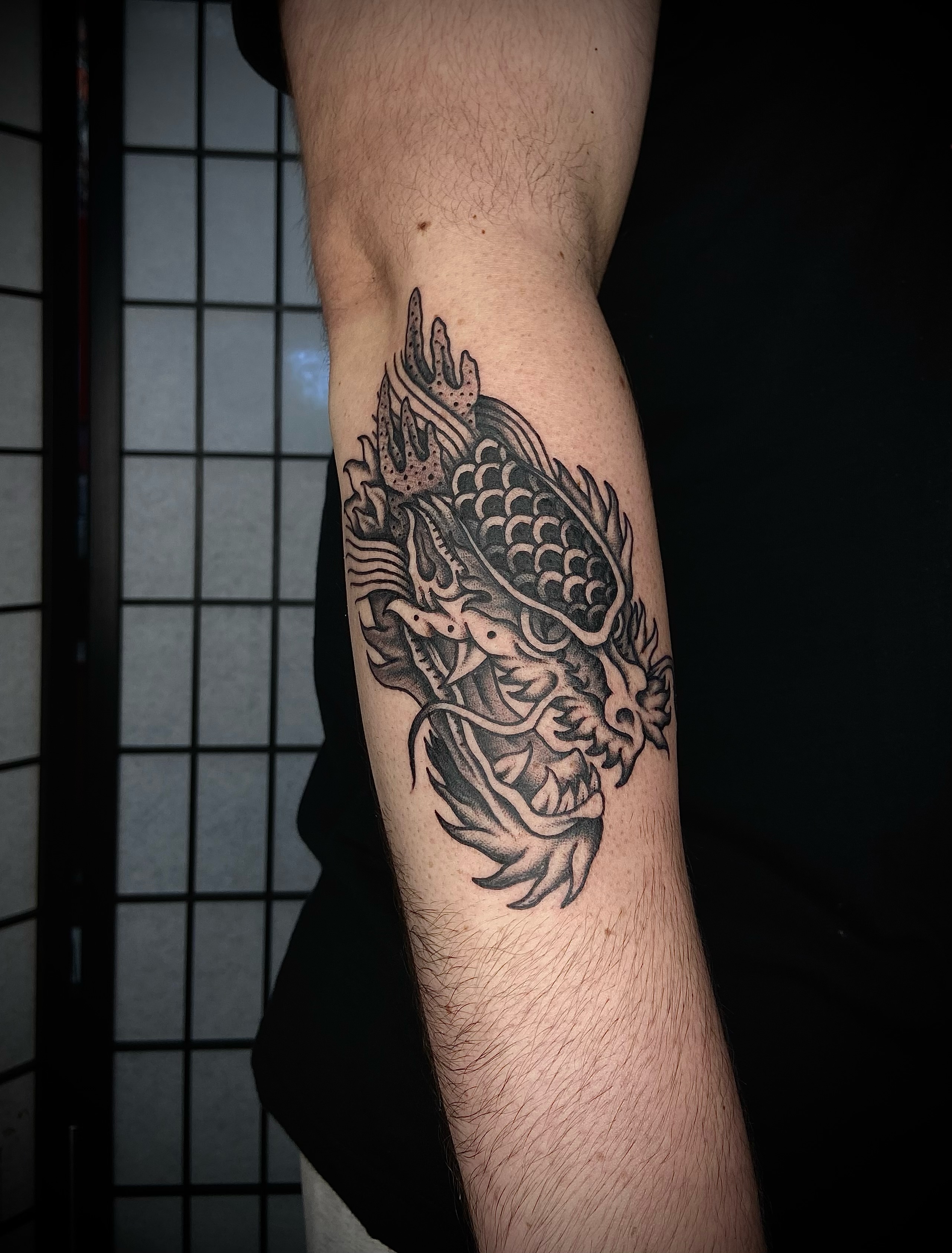 Dragon black and grey tattoo on the forearm by R y a n S m i t h