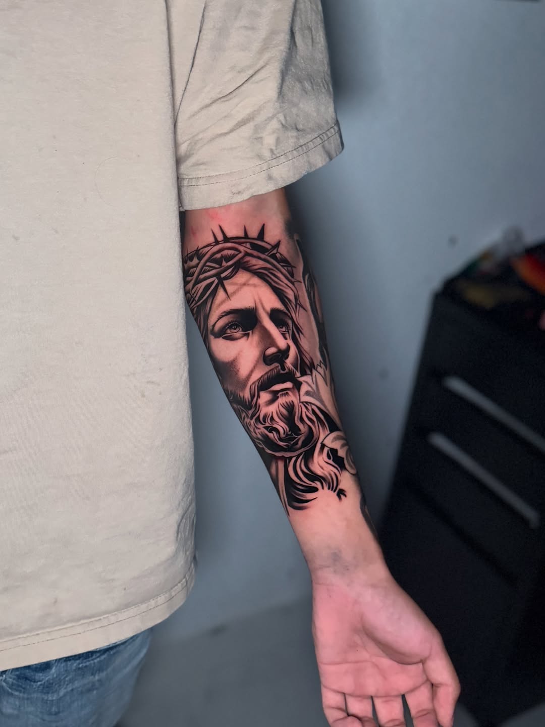 Jesus Christ portrait realism tattoo on the forearm by InkbyCasillas