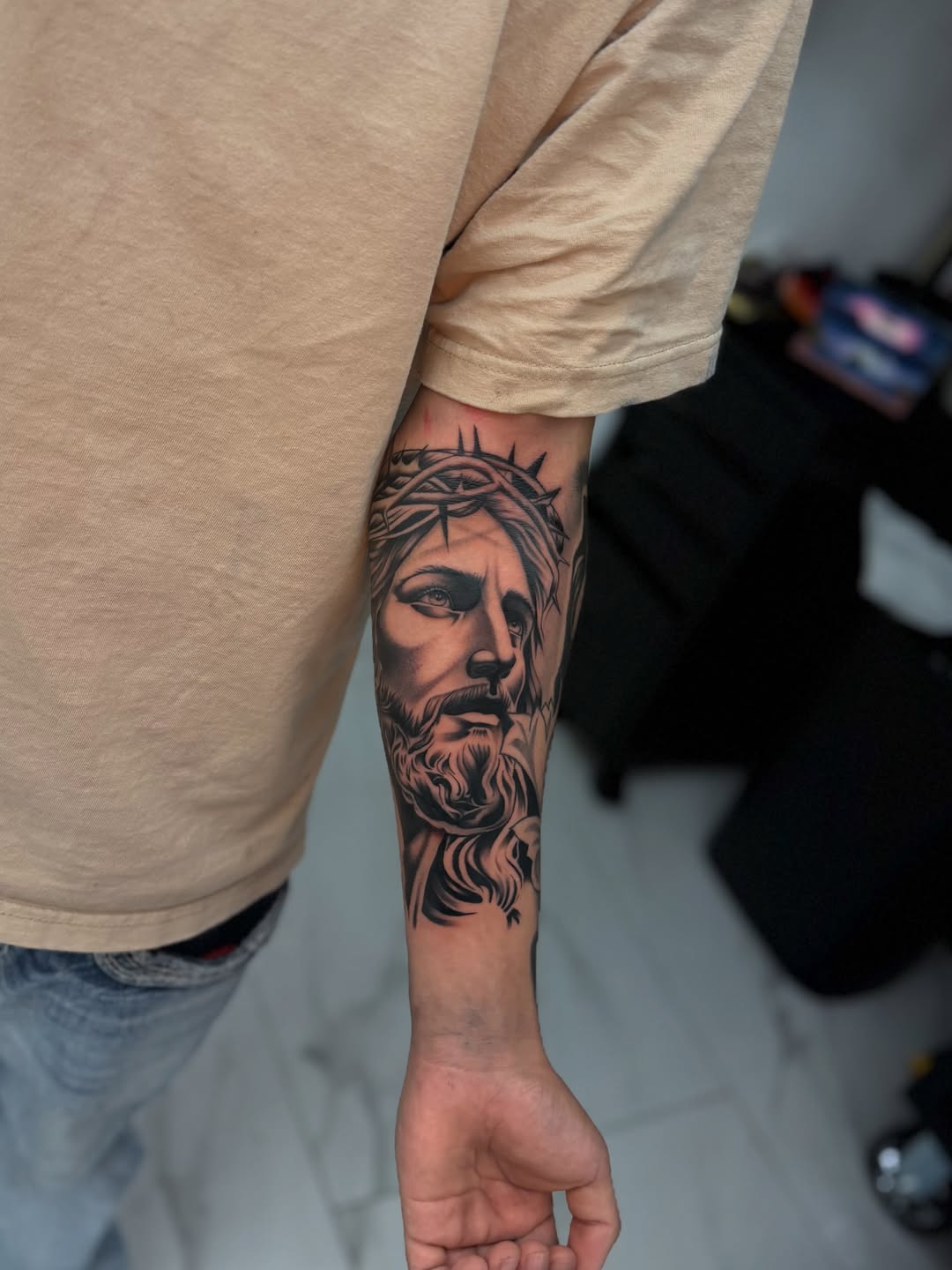 Jesus Christ portrait realism tattoo on the forearm by InkbyCasillas