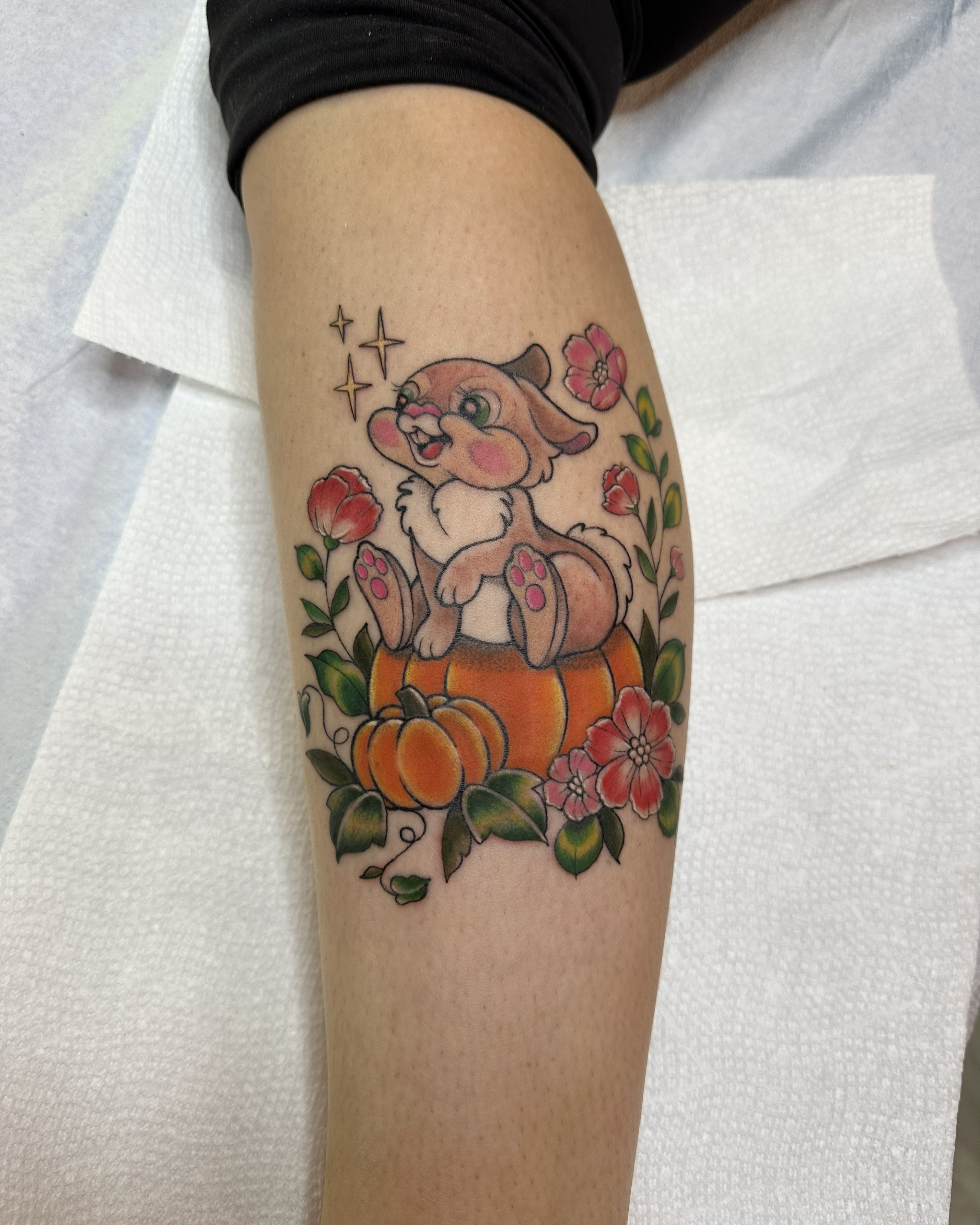Cat in pumpkin new school tattoo on the forearm by Dani Di Pietrantonio