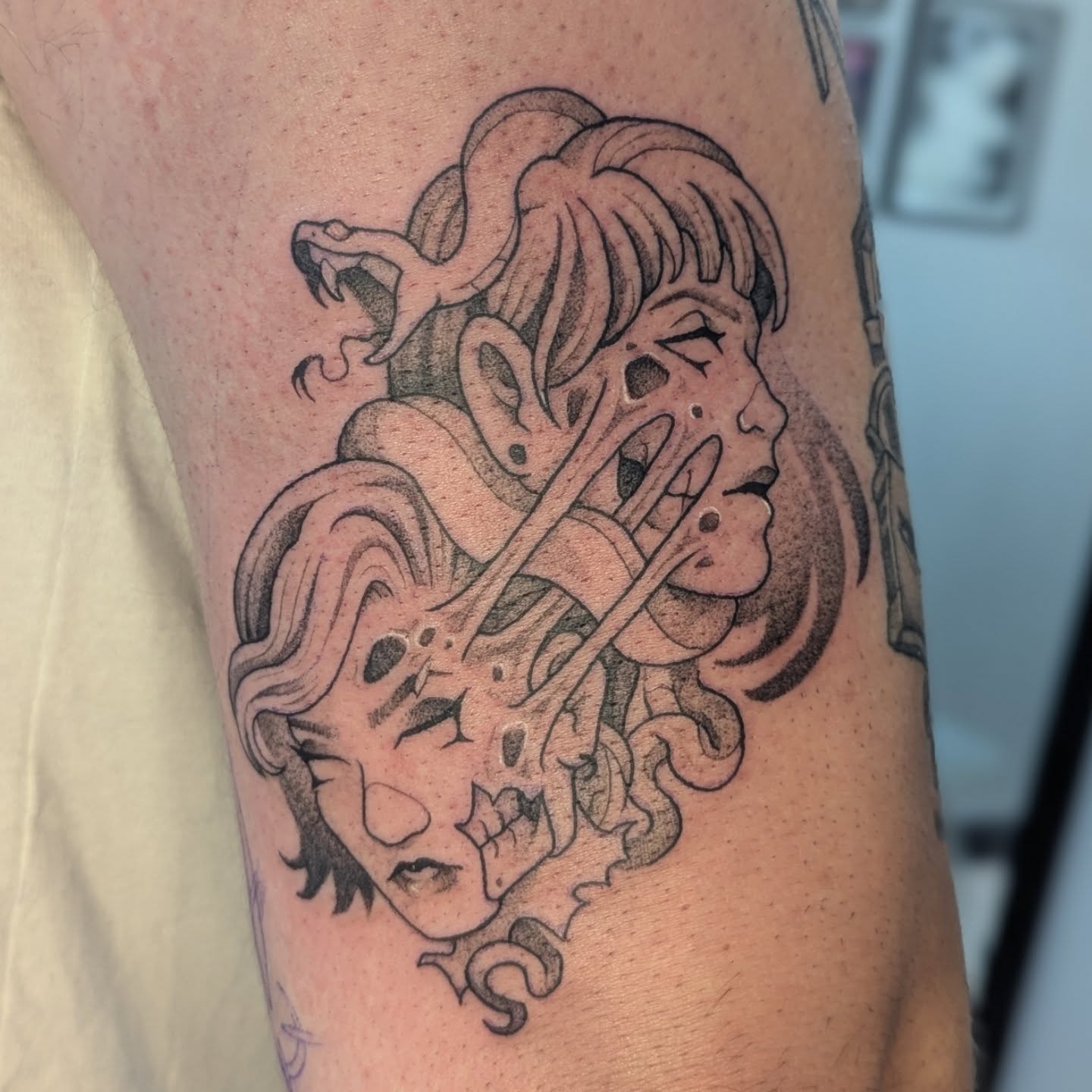 Woman with snakes black and grey tattoo on the forearm by Spencer Jennings, Westland, Michigan