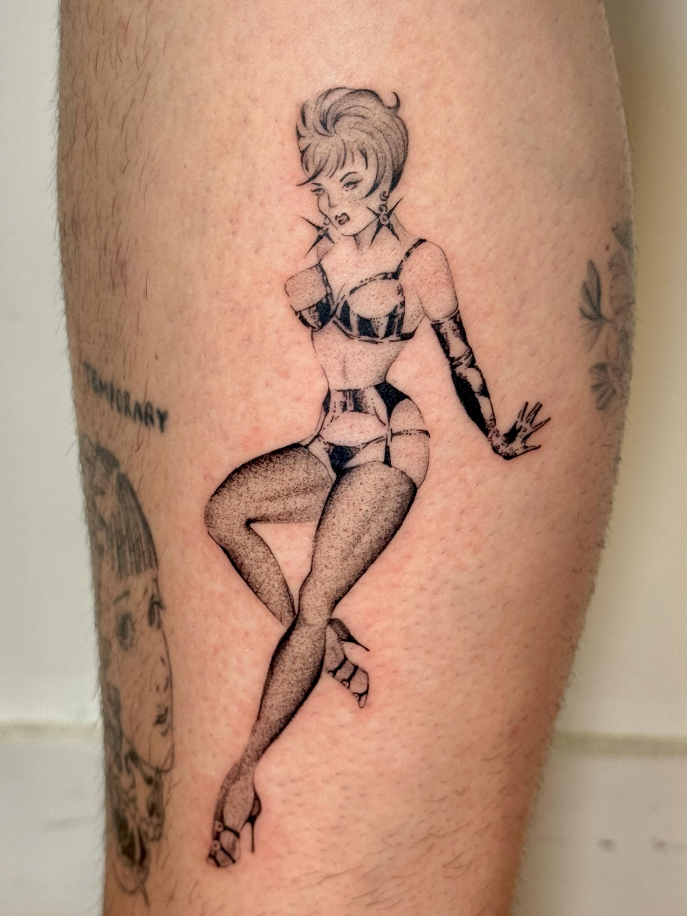 Pin-up girl dotwork tattoo on the thigh by tattoos by miss jackie o 🎱