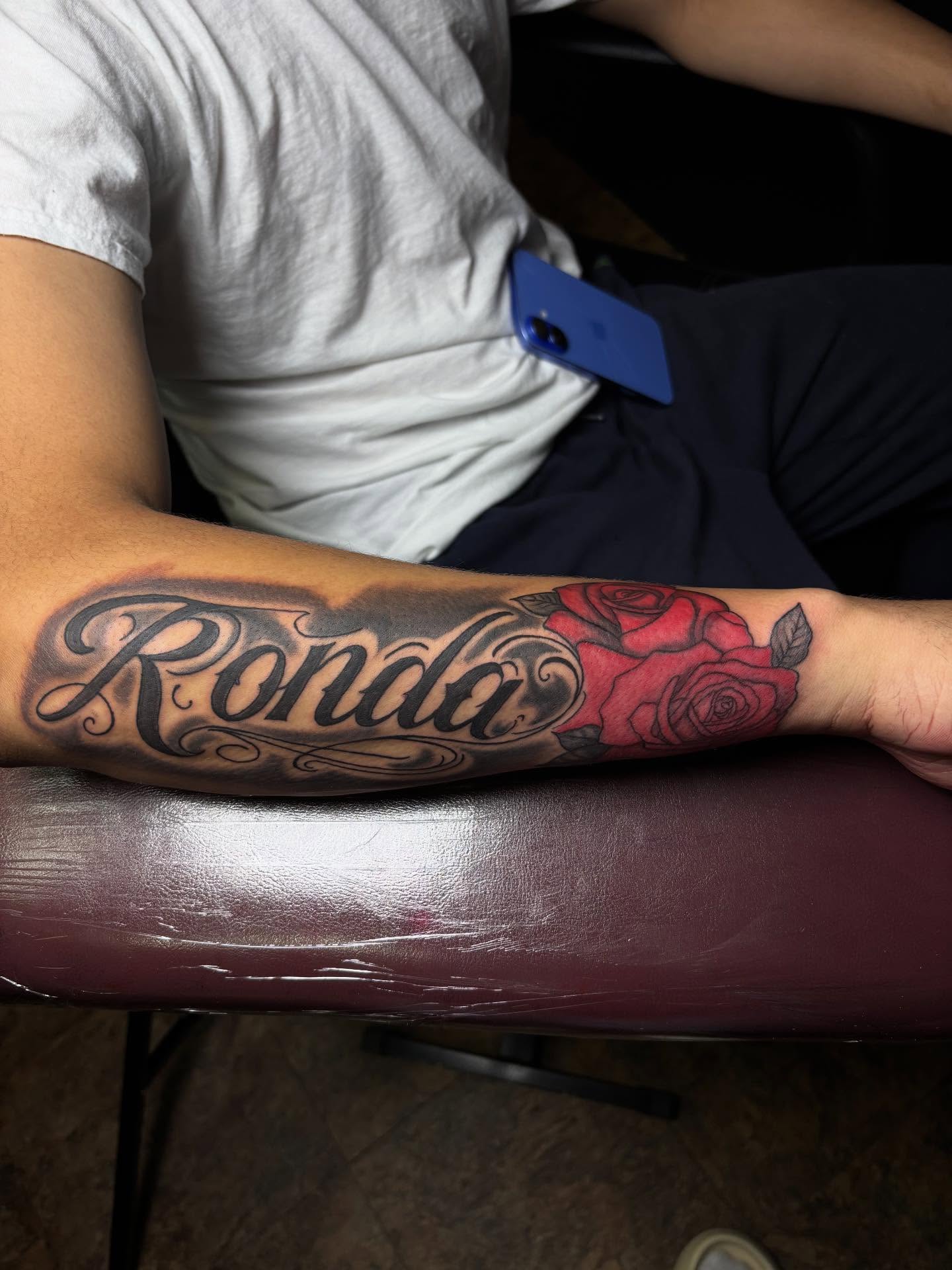 Ronda lettering script tattoo on the forearm by Inkys Tatts