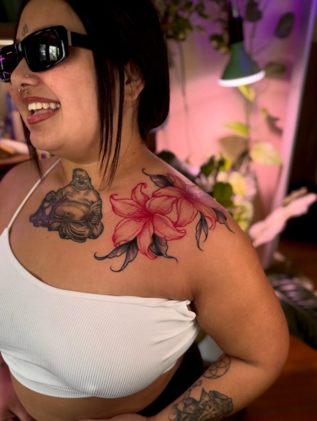 Buddha and flower American traditional tattoo on the shoulder by Angie Cotton