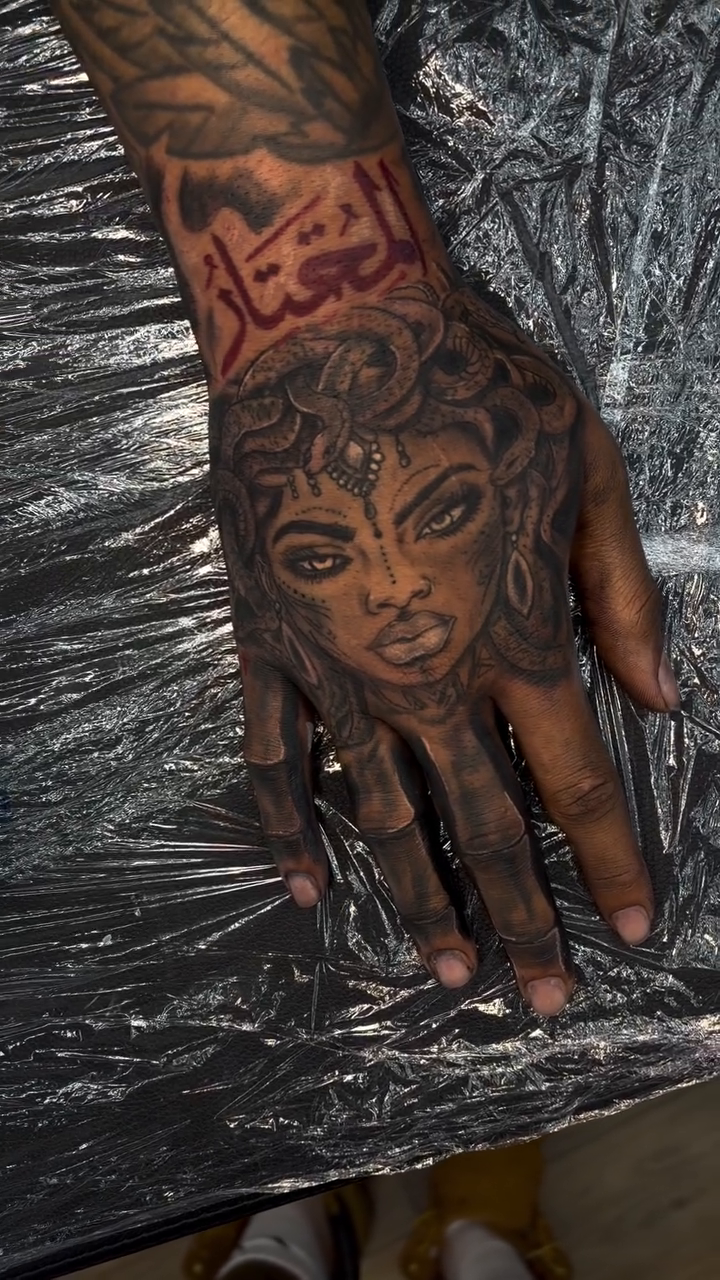 Realism tattoo on the hand by Mike Tatts