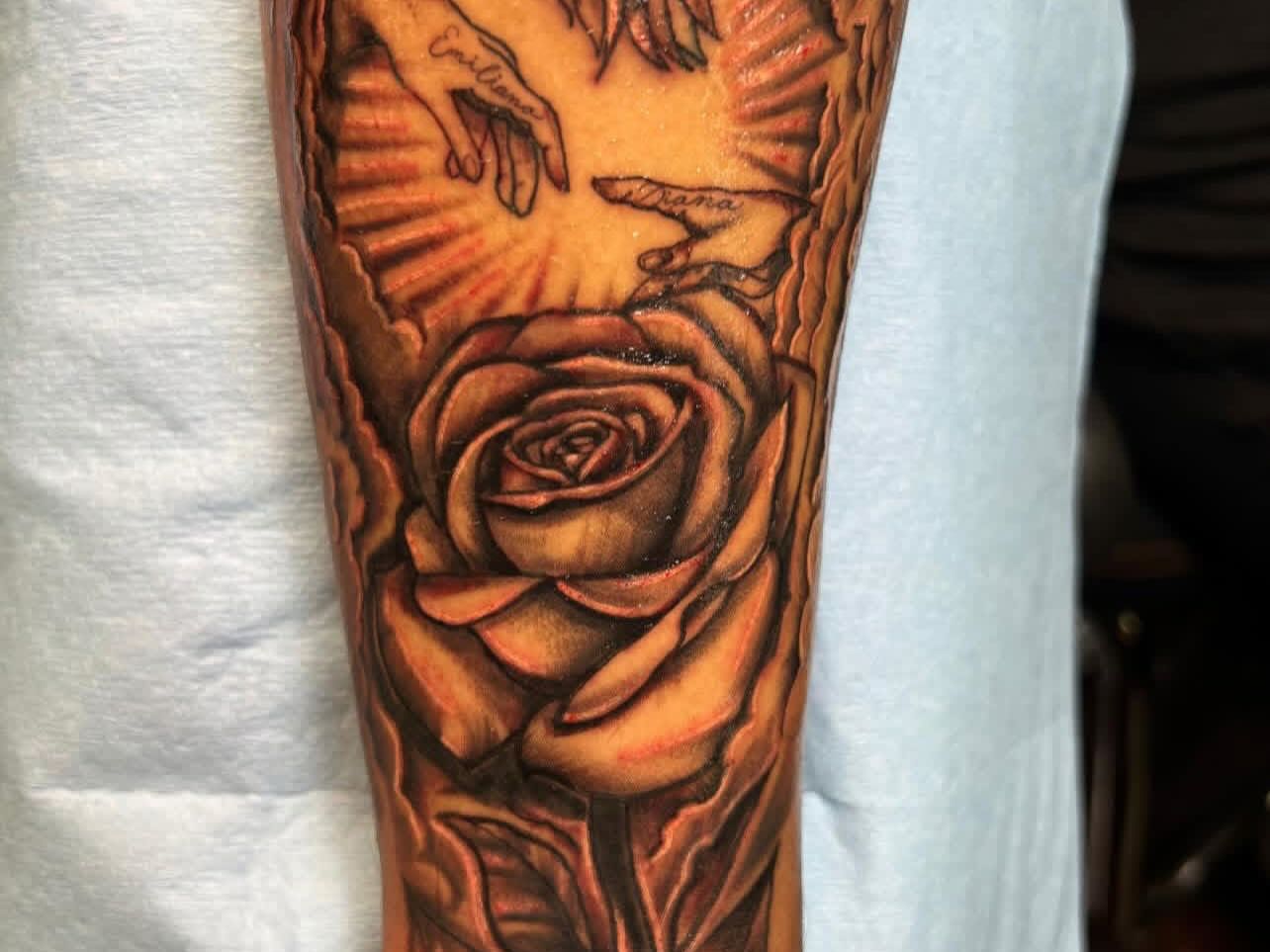Rose realism tattoo on the forearm by Tattoomobile
