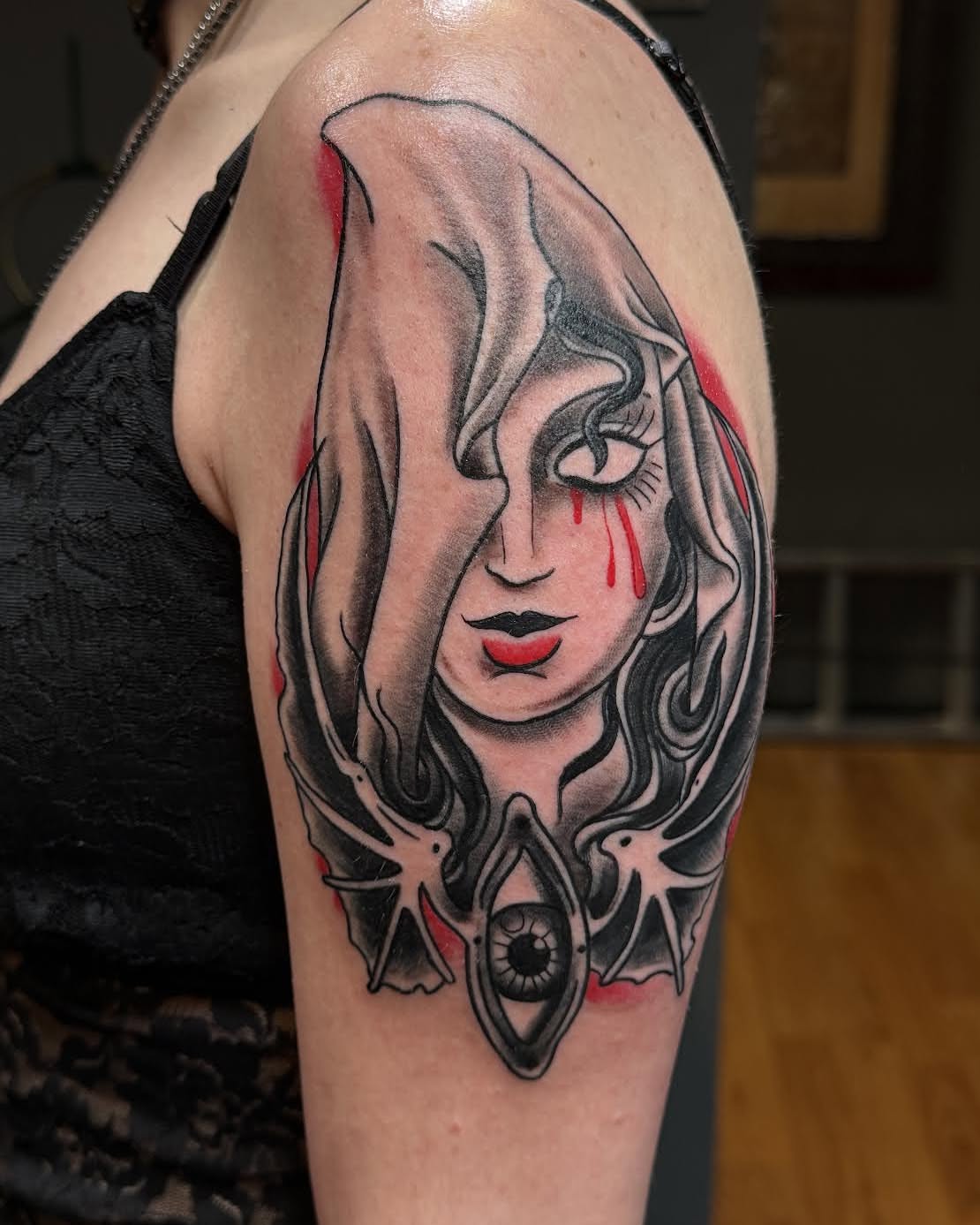 Woman's face American traditional tattoo on the shoulder by James Brooks