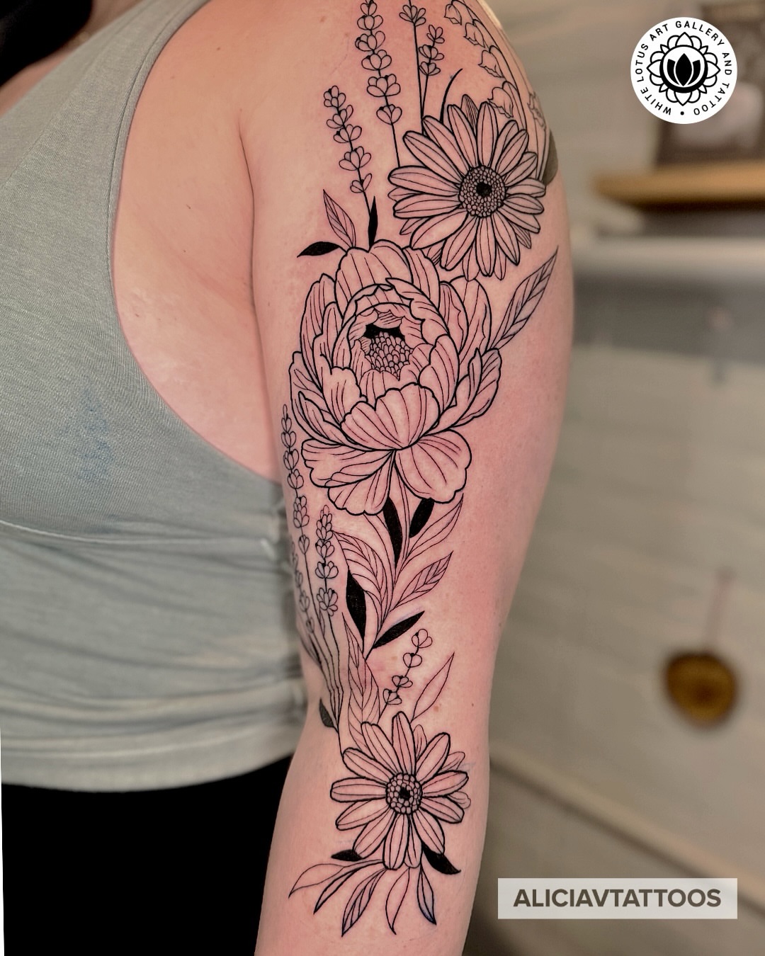 Floral bouquet black and grey tattoo on the forearm by Alicia Vasquez