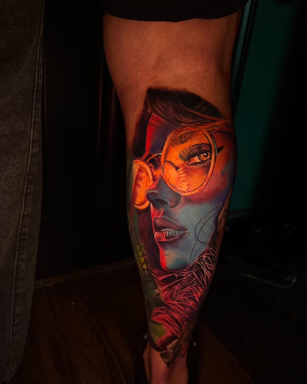 Woman with glasses surrealism tattoo on the forearm by T, Saugus, Massachusetts