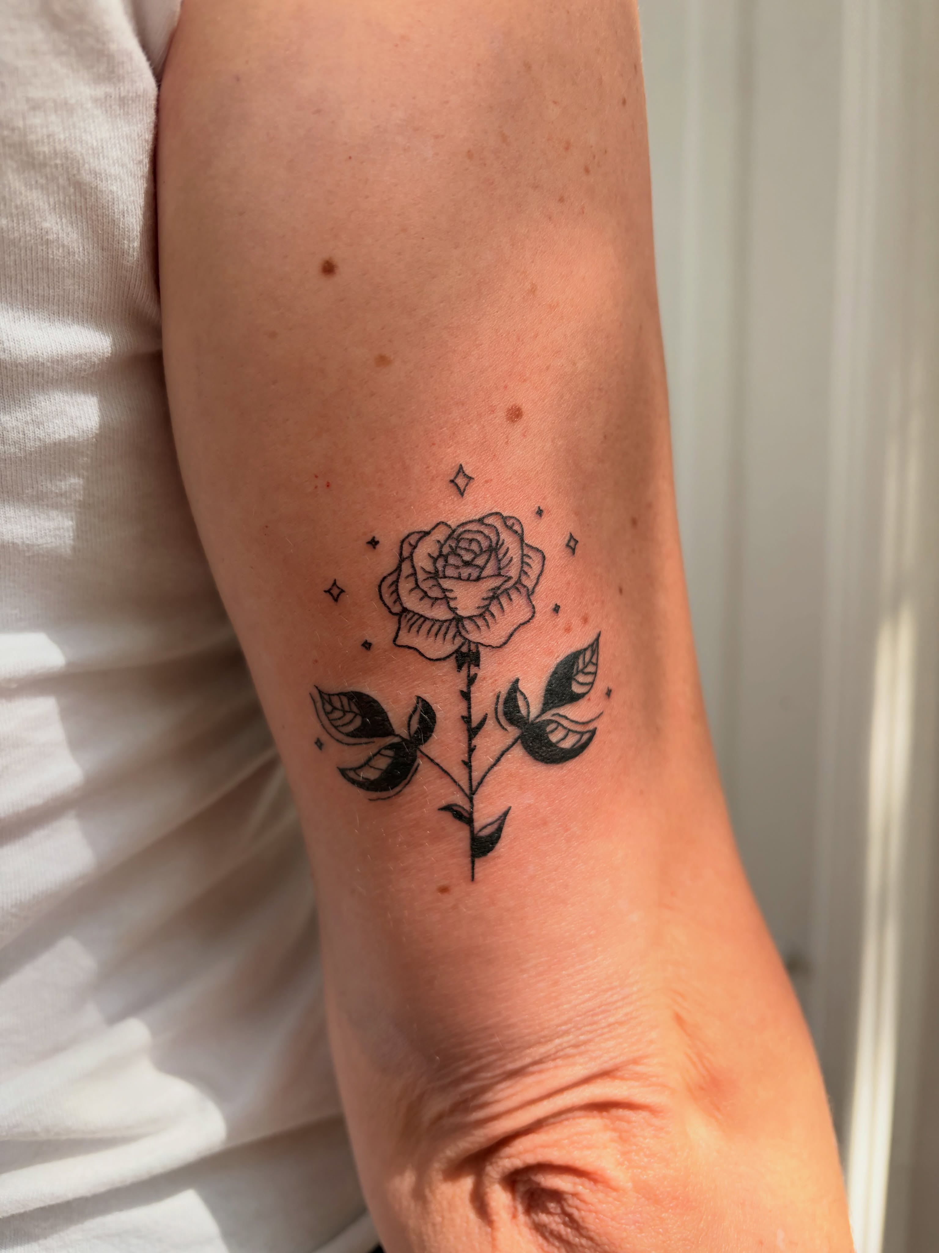 Rose black and grey tattoo on the forearm by Inky Birdz Tattoos