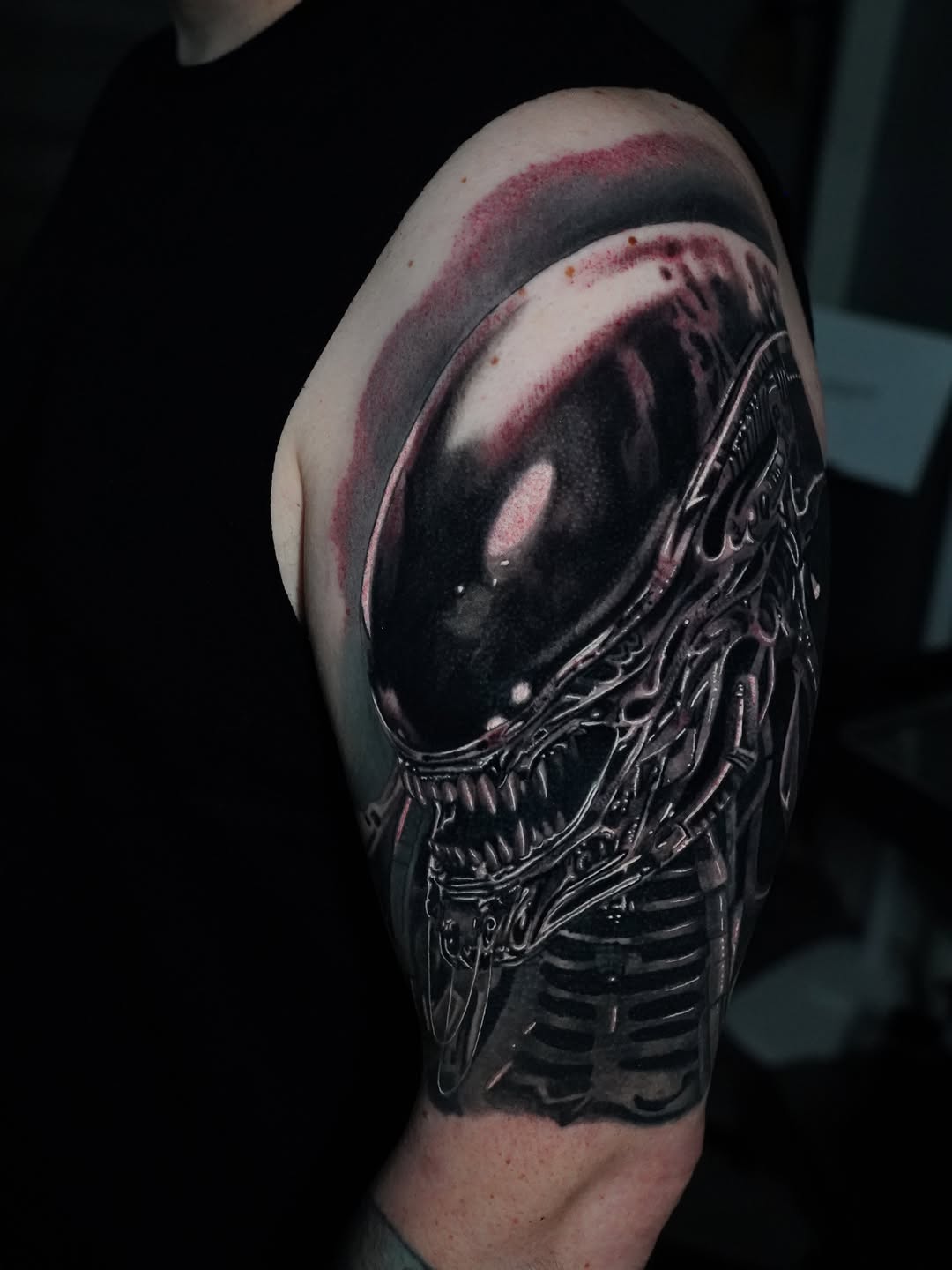 Alien xenomorph head realism tattoo on the upper arm by Joshua Phillips, Mansfield, Ohio
