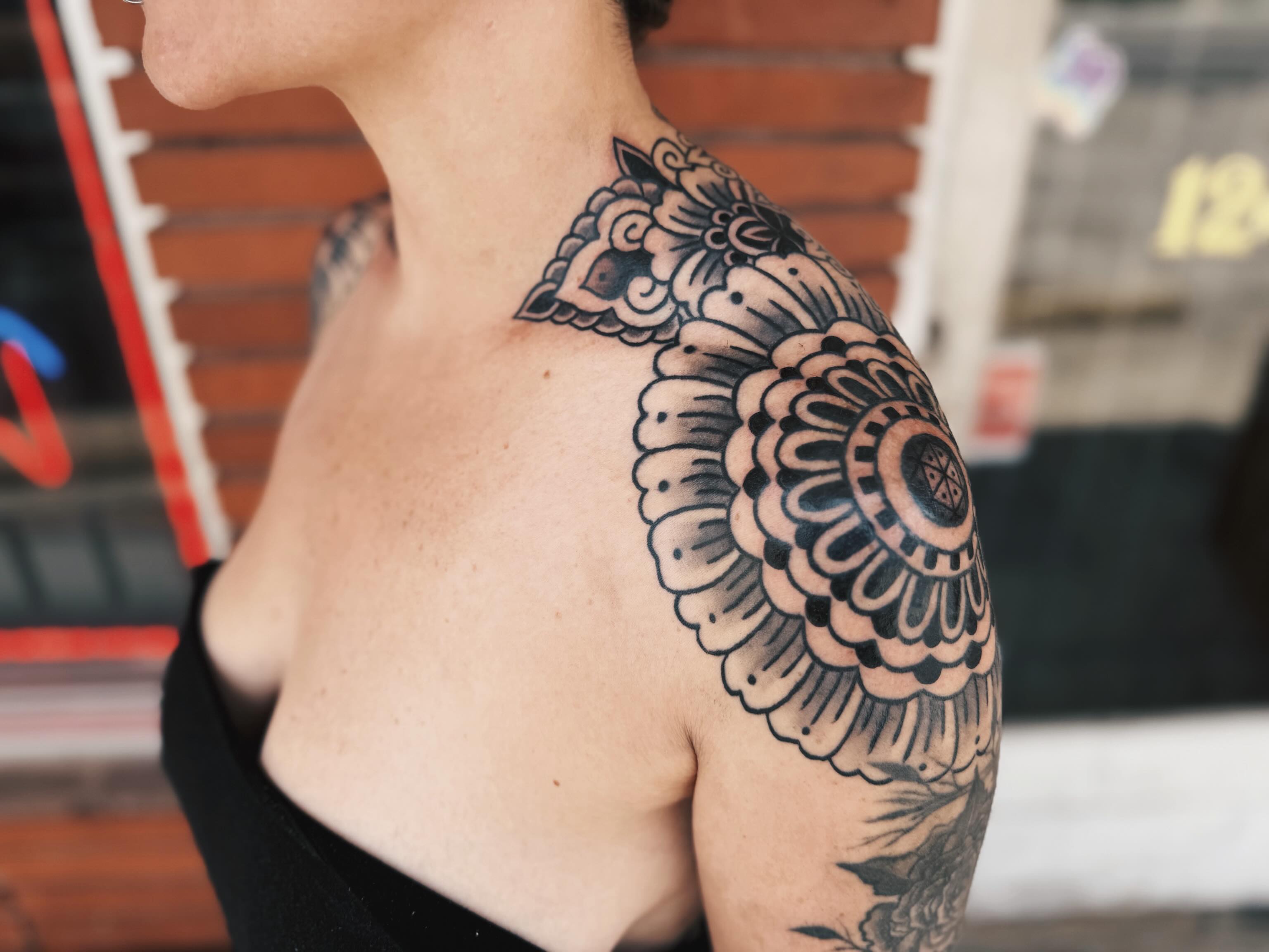 Floral mandala black and grey tattoo on the shoulder by @amandahowtattoo