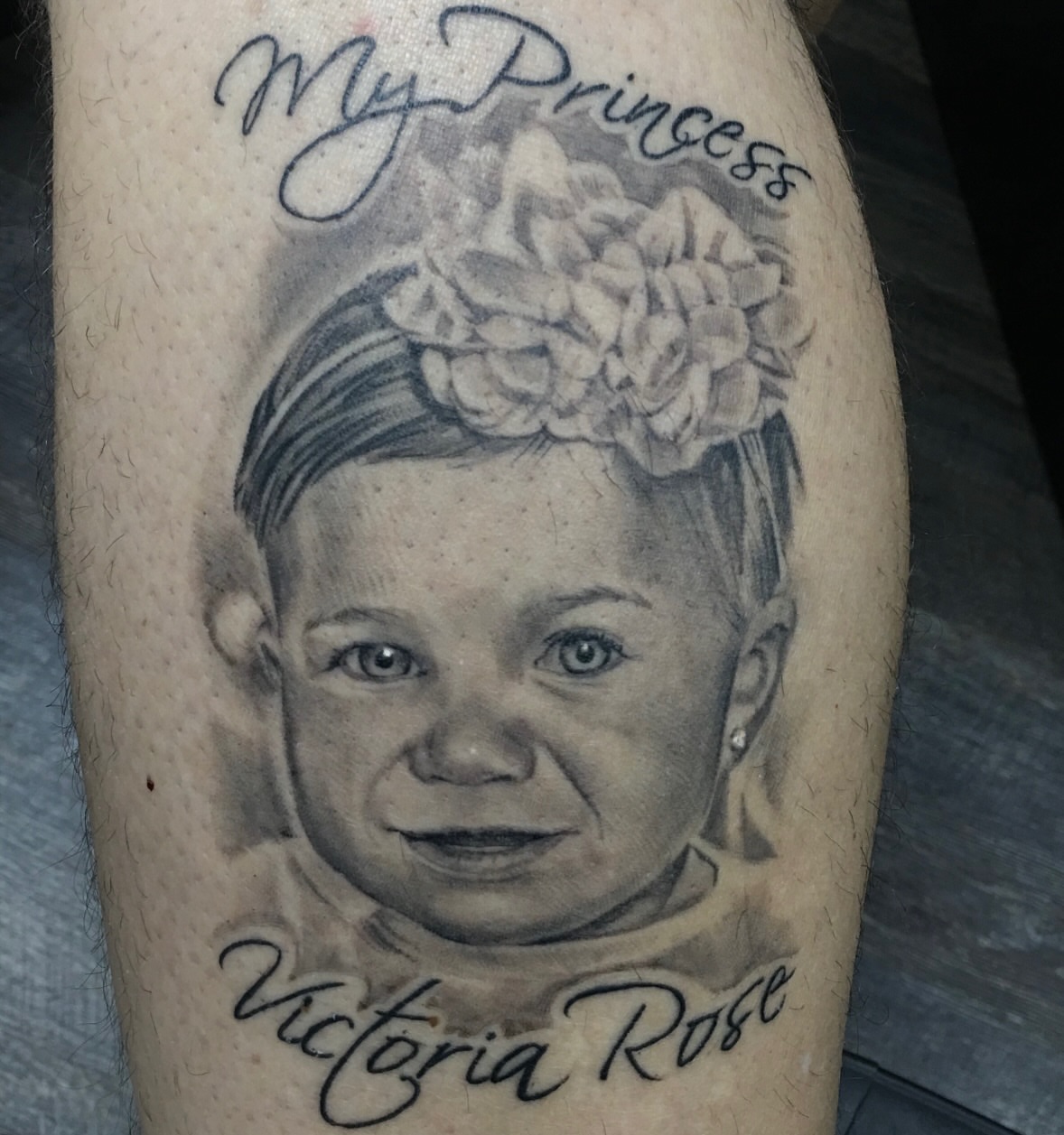 Child portrait realism tattoo on the forearm by Matthew Doherty