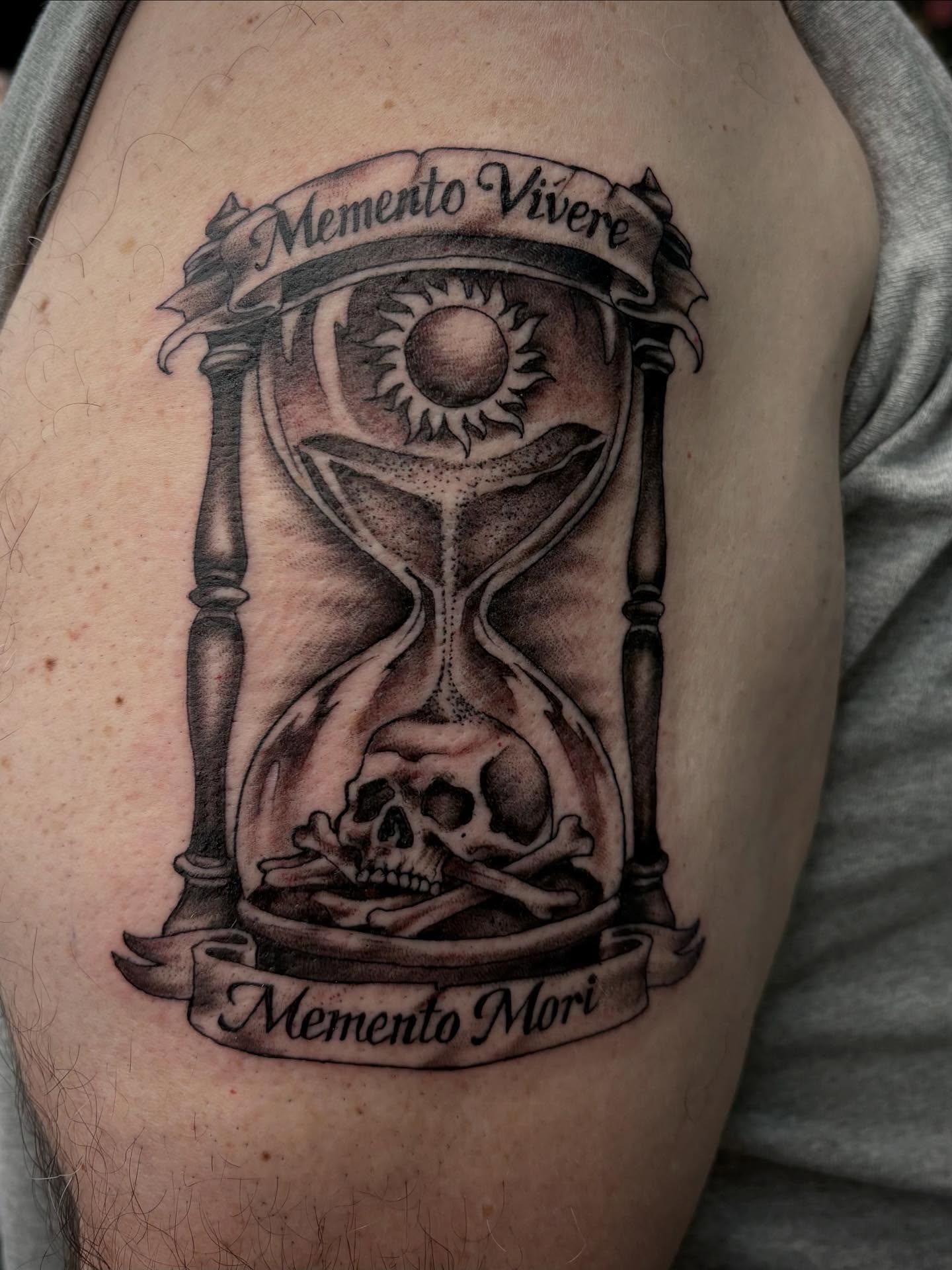 Hourglass with skull realism tattoo on the forearm by Robbie Reel, Wichita, Kansas