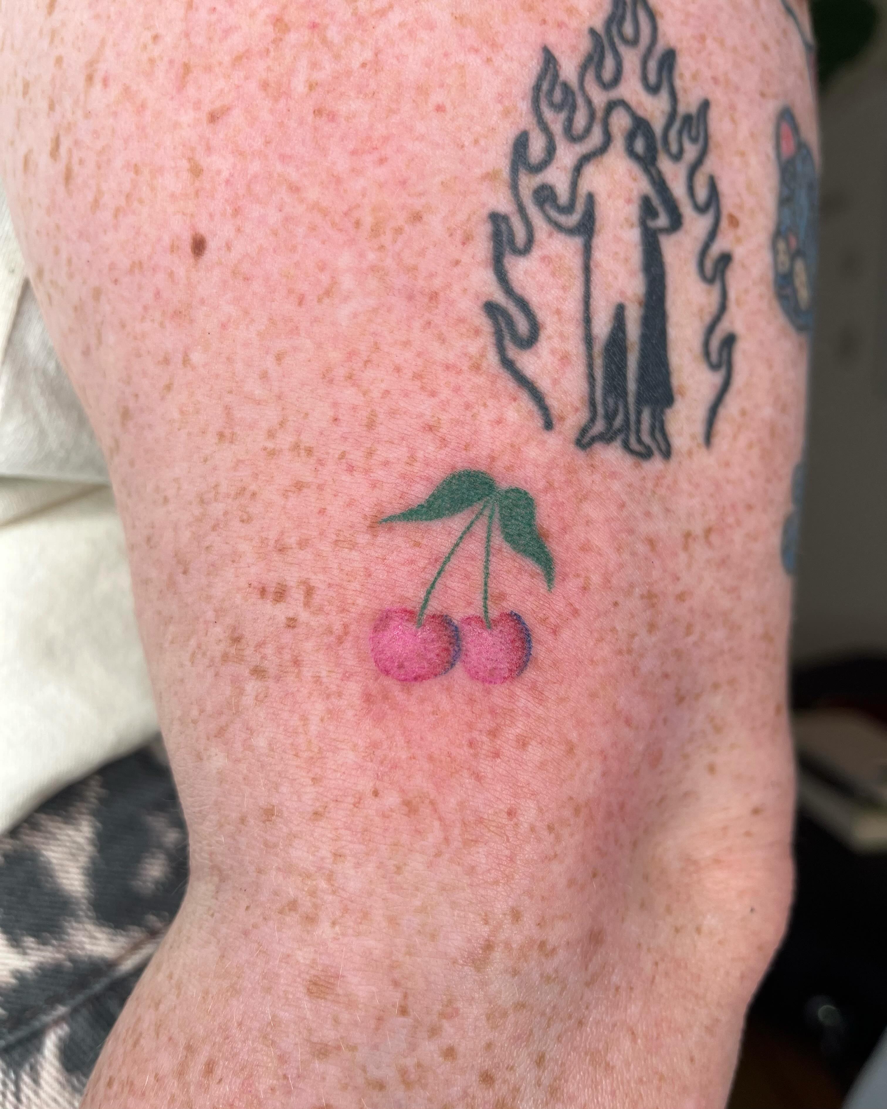 Cherry dotwork tattoo on the forearm by Jenna