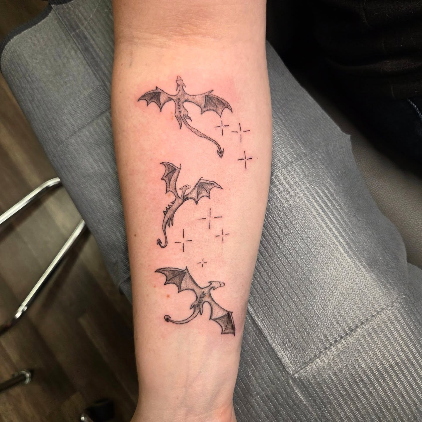 Dragons dotwork tattoo on the forearm by Mary