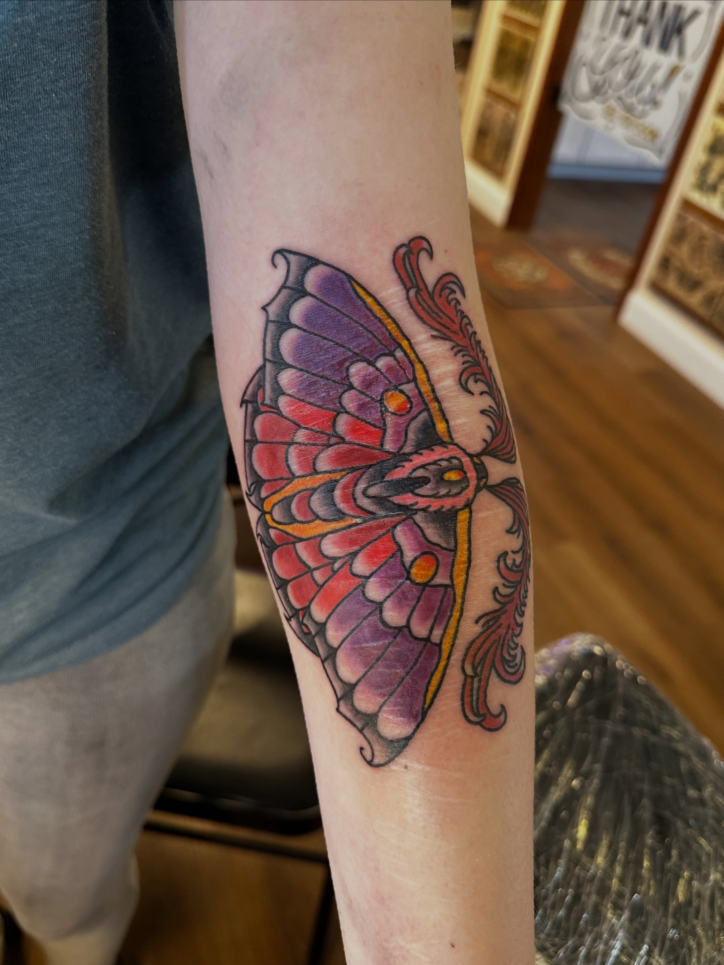 Butterfly new school tattoo on the forearm by Drew’s Tattoos (NH)