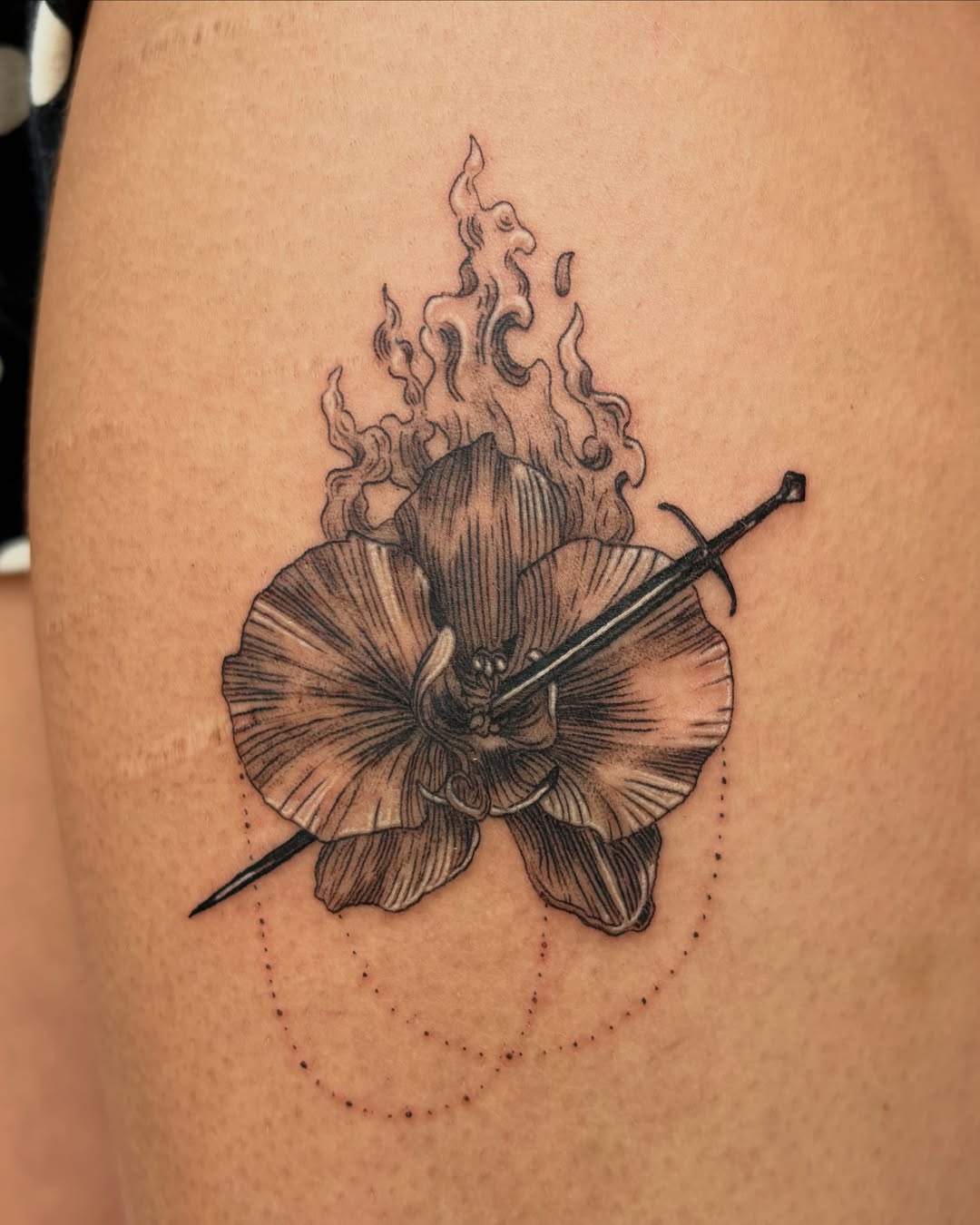 Flaming flower with cross realism tattoo on the thigh by Kylah Amin Tattoo