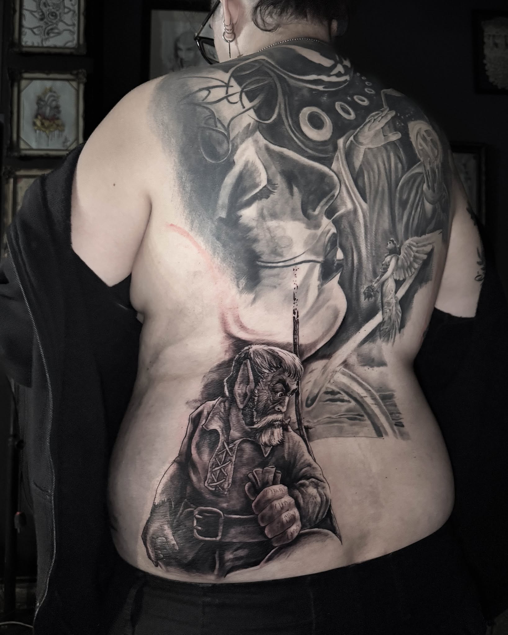 Orc and angel realism tattoo on the back by Bruno Moretti