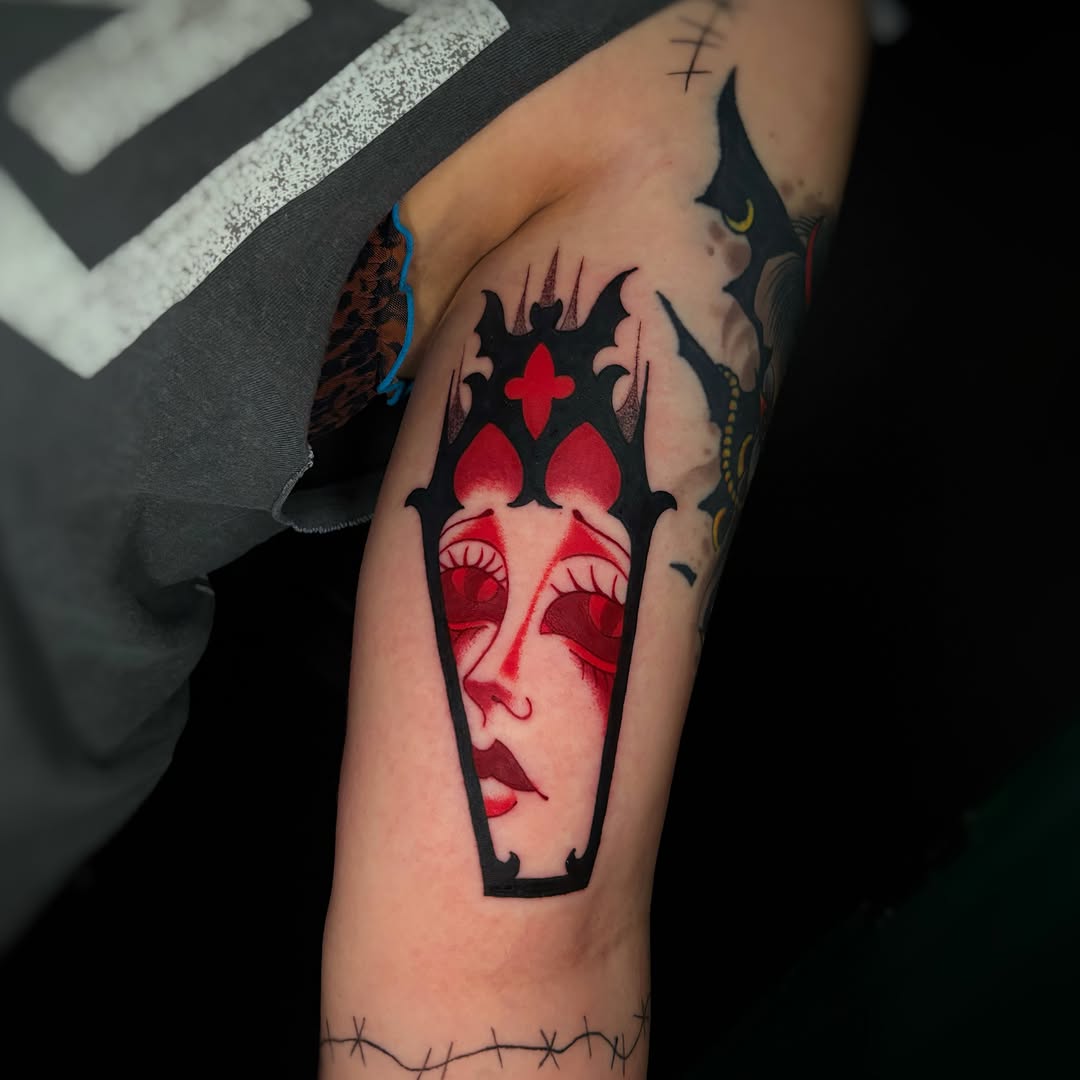 Woman's face in coffin American traditional tattoo on the forearm by ✠ courtney jorée ✠