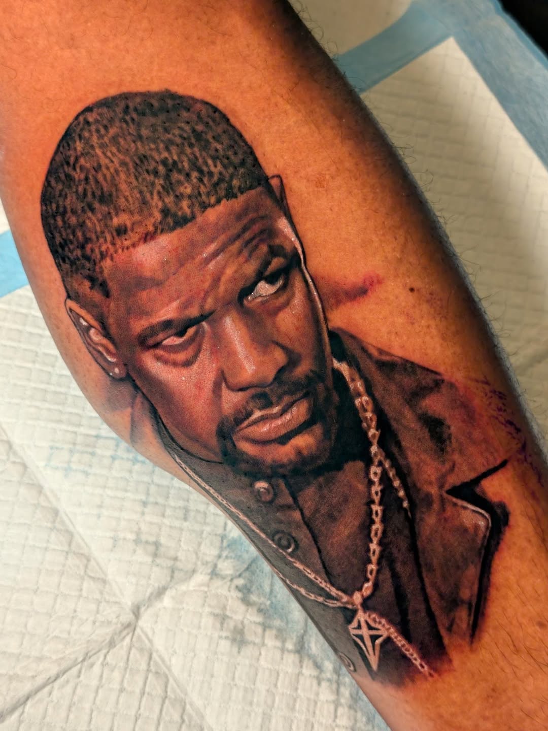 Portrait of Denzel Washington realism tattoo on the forearm by Miami Florida Tattoo Artist