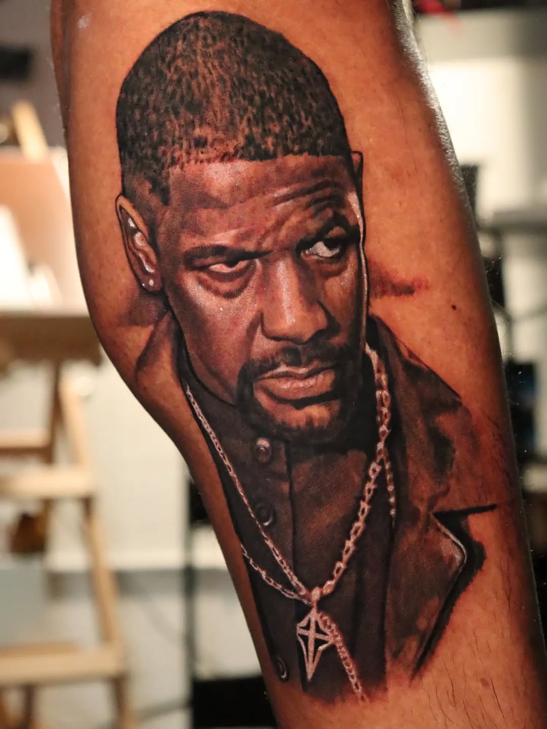 Portrait of Denzel Washington realism tattoo on the forearm by Miami Florida Tattoo Artist