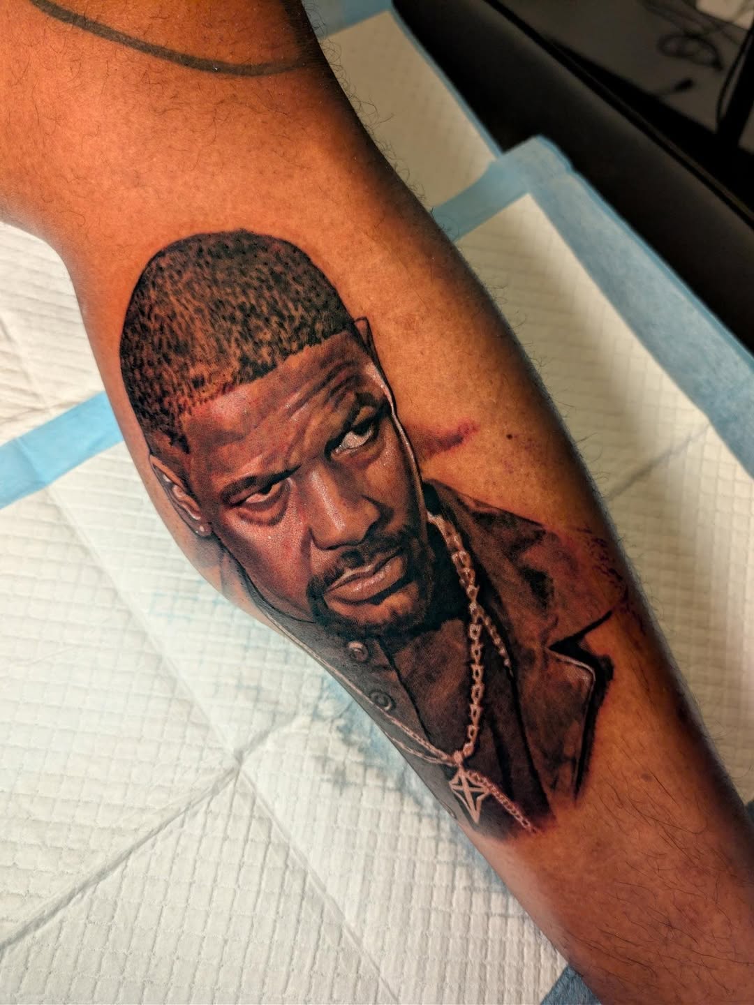 Portrait of Denzel Washington realism tattoo on the forearm by Miami Florida Tattoo Artist