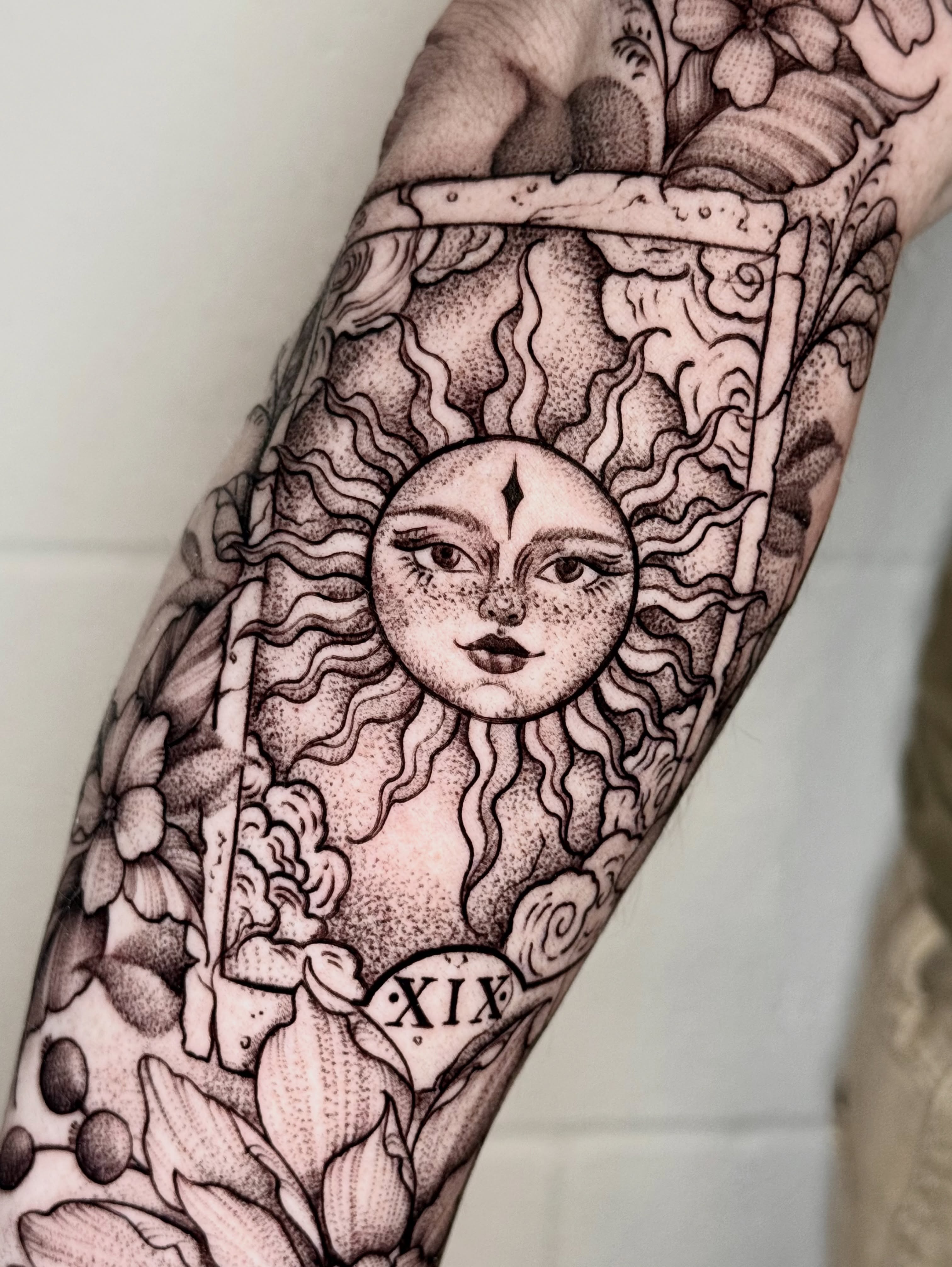 Sun and floral dotwork tattoo on the forearm by ℳ𝒾𝓇𝓉𝒽𝒶 𝒯ℴ𝓇𝓇ℯ𝓈, San Diego, California