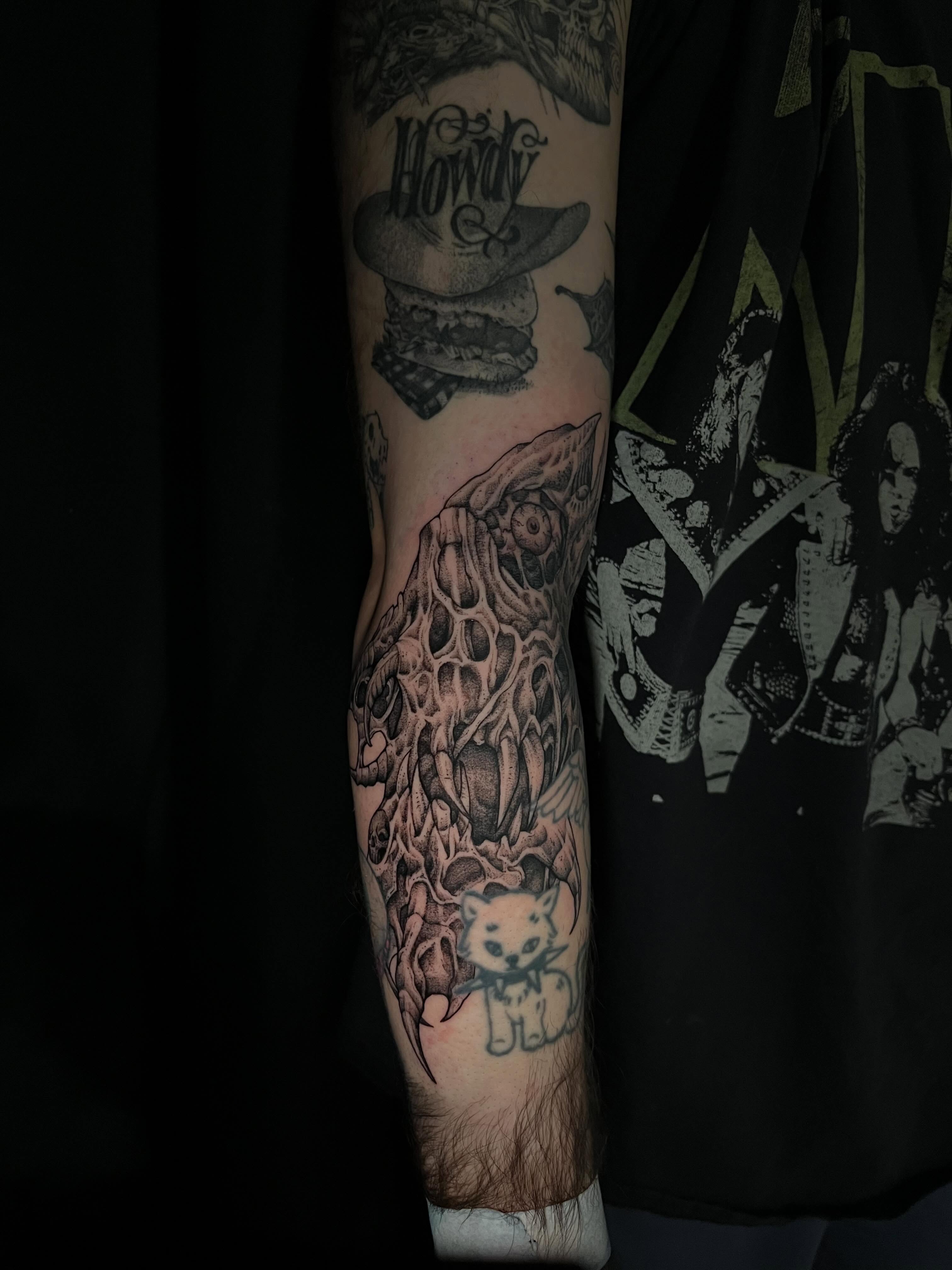 Cat skull geometric tattoo on the forearm by Crawlspacecadet