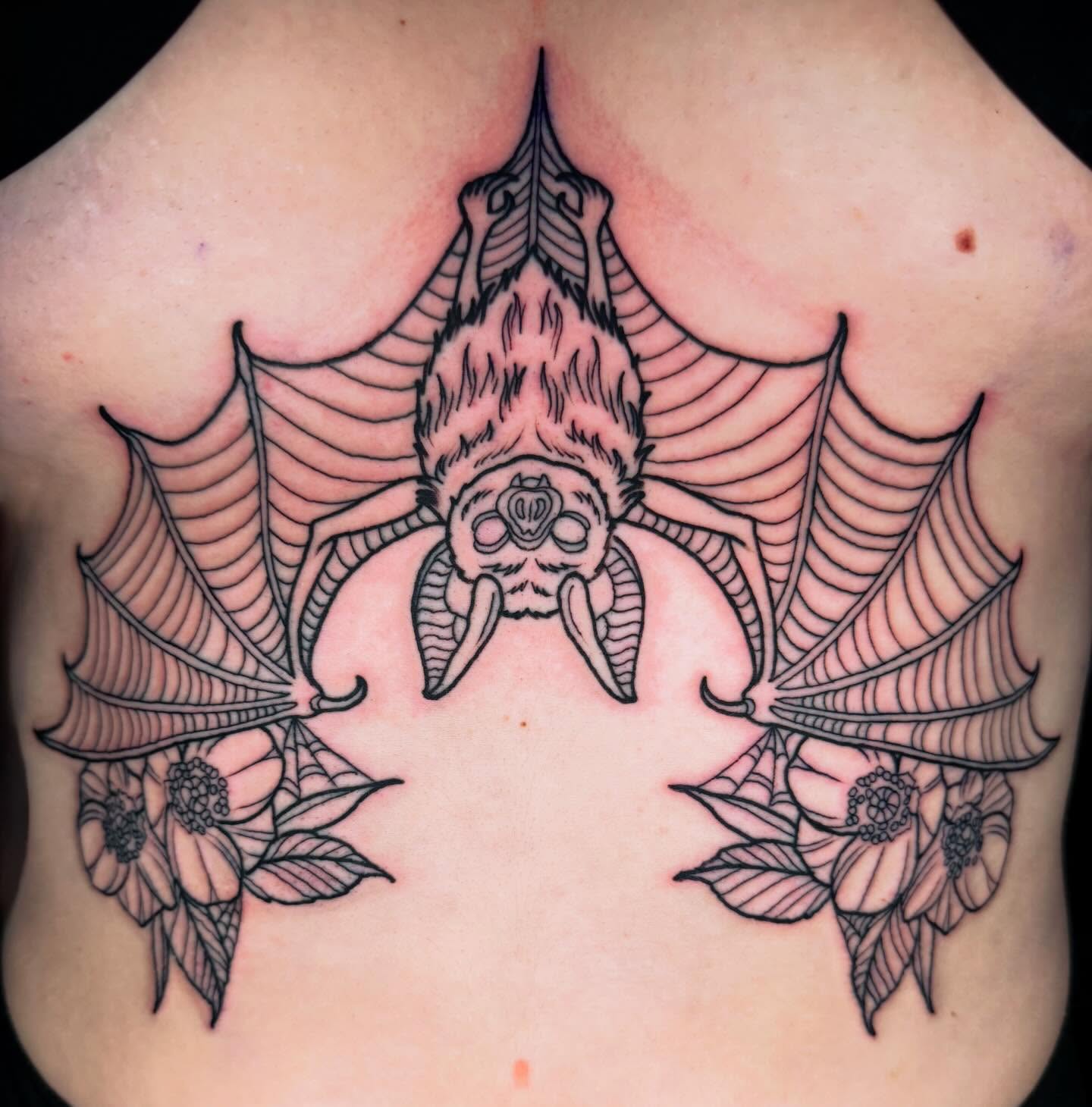 Bat geometric tattoo on the chest by Trenton Helms