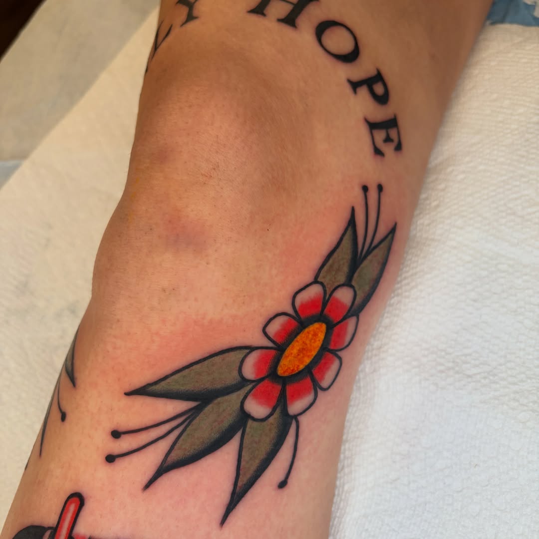 Flower American traditional tattoo on the forearm by rachael