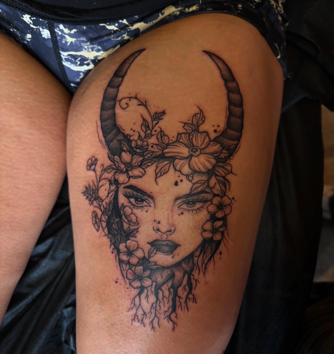 Bull head with floral crown realism tattoo on the thigh by destany aguilera, Davenport, Iowa