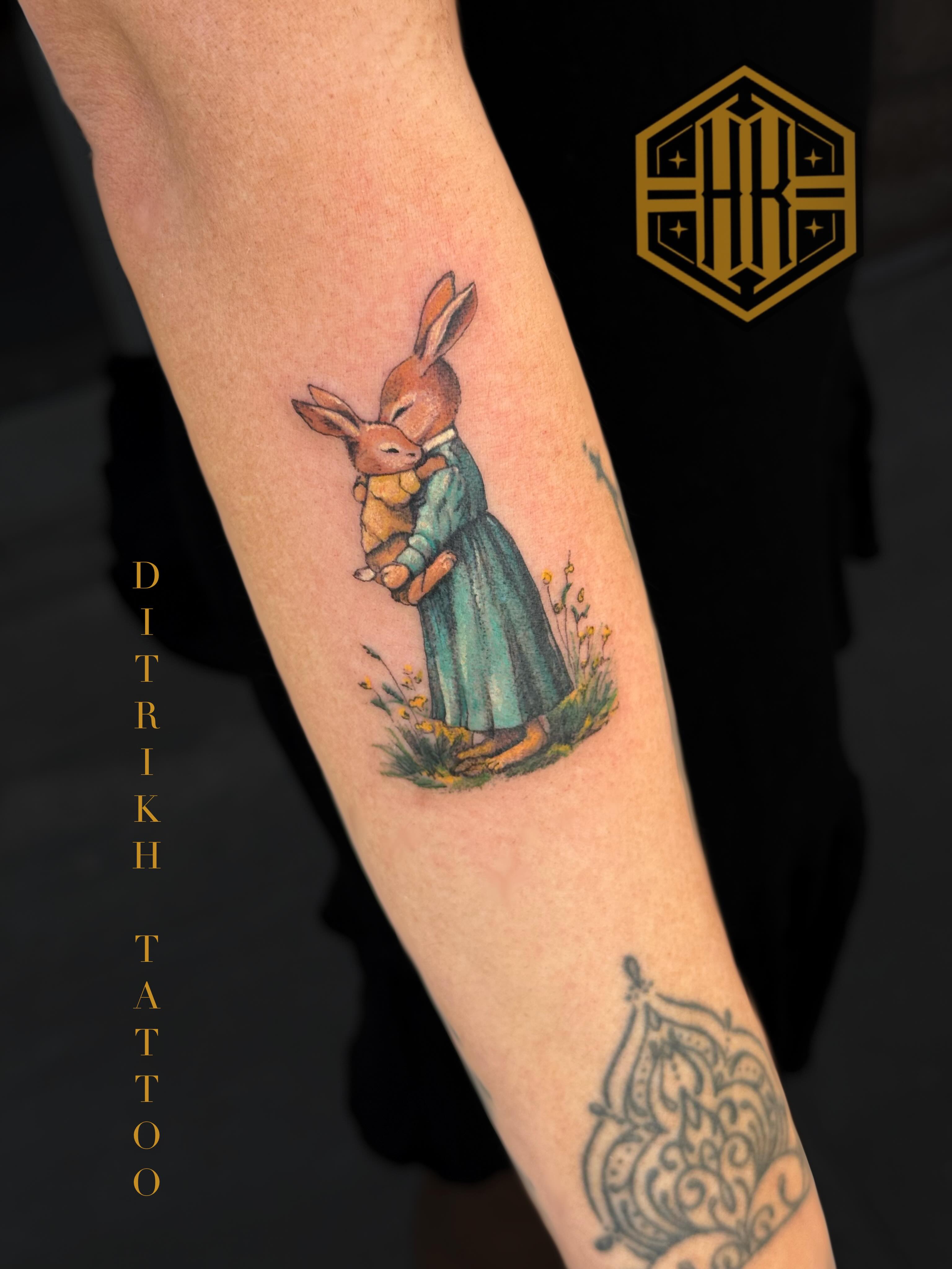 Rabbit and child realism tattoo on the forearm by KET, Calgary, Alberta