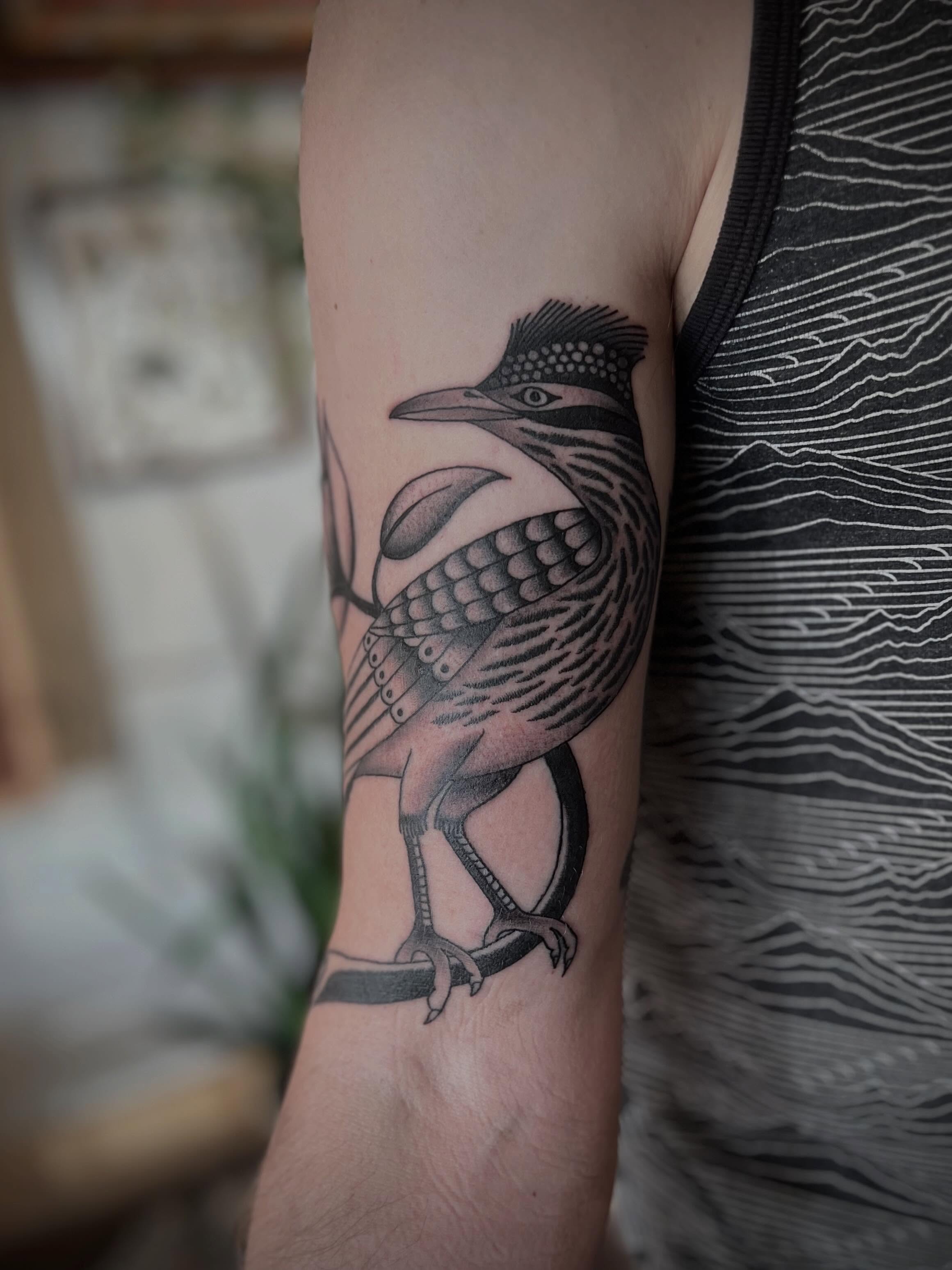 Bird black and grey tattoo on the forearm by David Stein